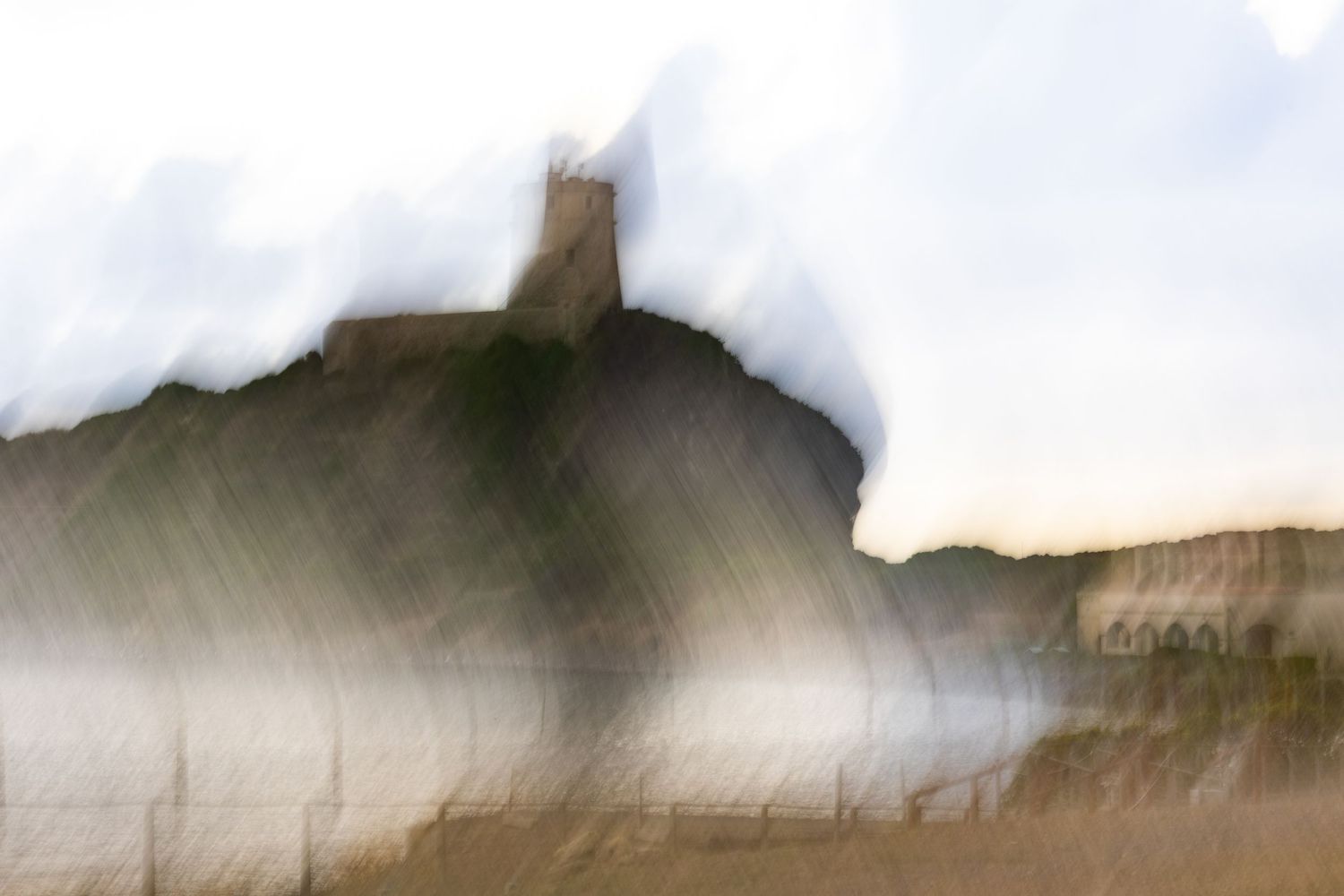 Minimalist landscape photographs with foggy white sky and dark silhouetted hills.