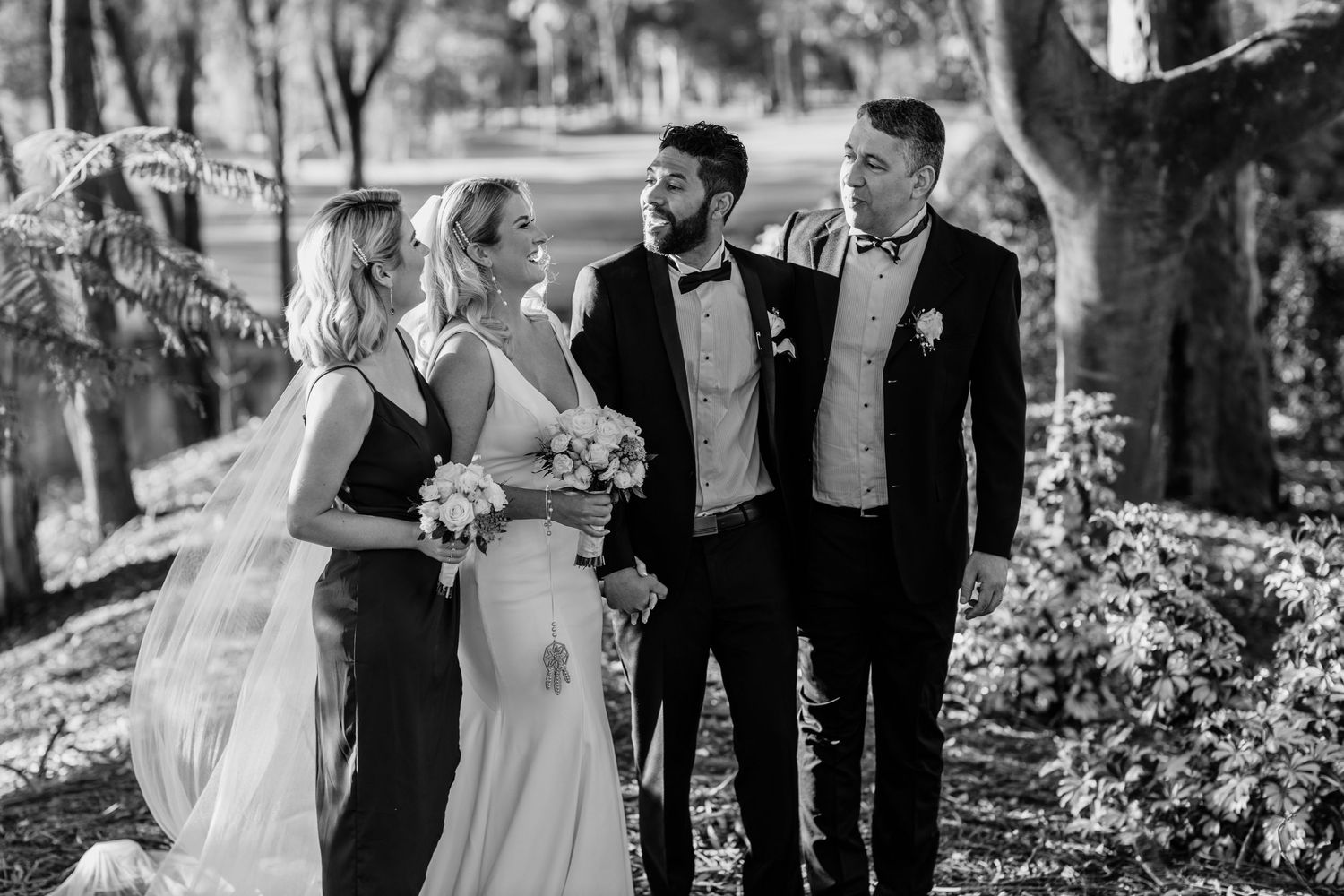 A black and white collage of candid wedding moments showing laughter and joy during an outdoor celebration.