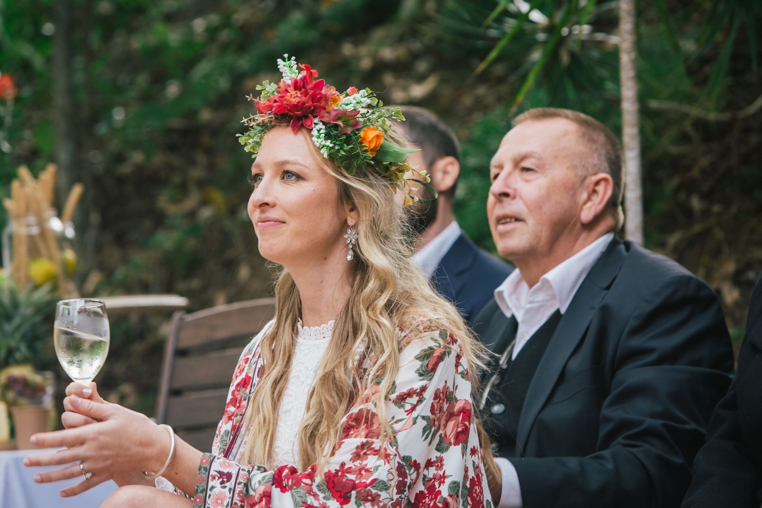 Outdoor wedding reception with guests enjoying drinks amidst natural forest surroundings.DIY wedding Gold Coast elopement photographer Gold