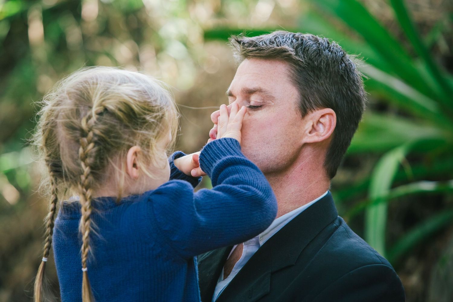 Sweet moment between parent and child during outdoor wedding celebration.DIY wedding Gold Coast elopement photographer Gold Coast