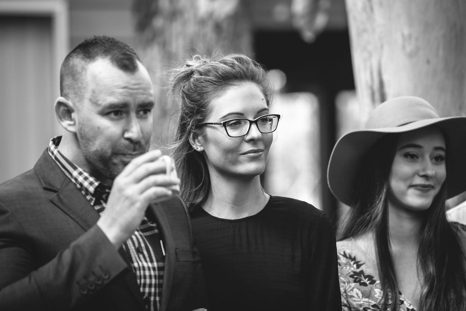 Black and white candid moments captured during an event.