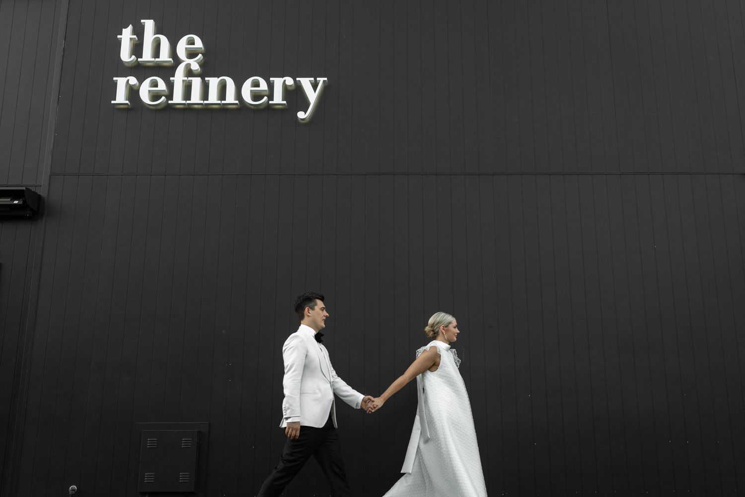 Minimalist wedding photos against dark industrial building exterior. The refinery wedding venue. Brisbane.