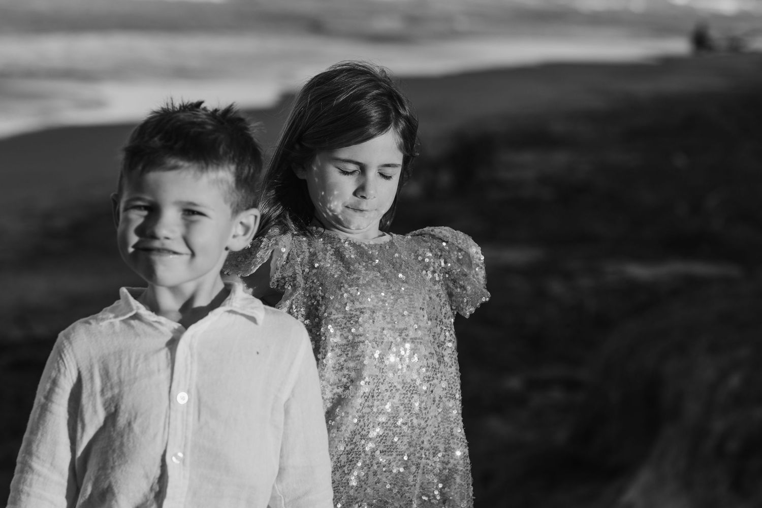 Black and white beach portraits capturing candid moments and natural interactions.Family photography cabarita New South Wales Cabarita headl