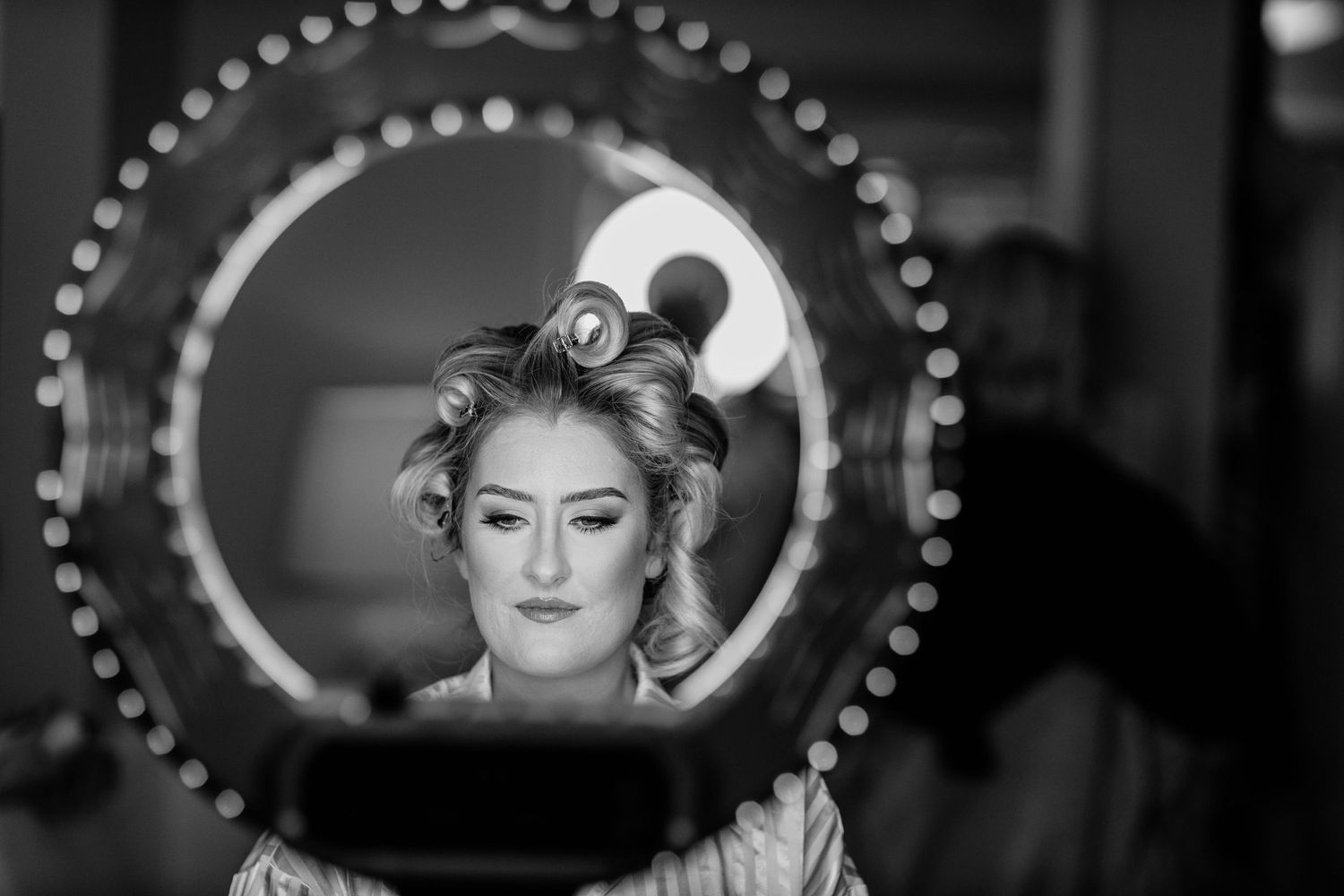 A black and white photo collage shows a performer in dramatic lighting and poses on stage. Surfers Paradise Golf Club wedding.