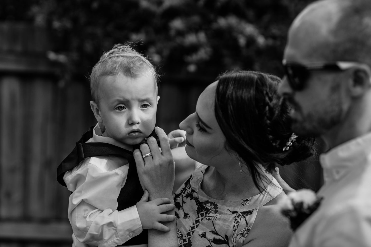 Black and white candid moment captured during an outdoor family celebration.Gold Coast elopement photographer