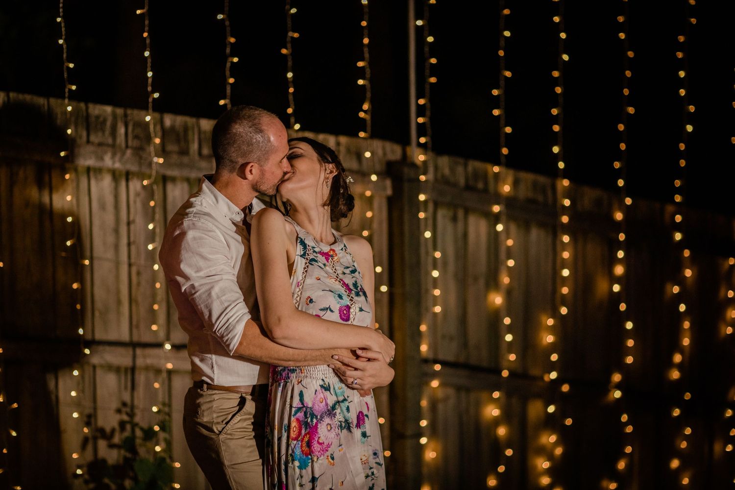 Evening celebration with romantic string lights creating a warm ambiance. Gold Coast elopement photographer