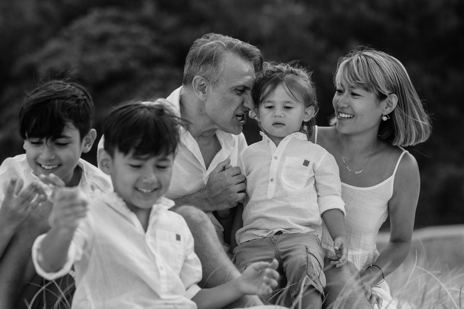 Series of candid black and white shots showing family joy and connection outdoors.Gold Coast candid family photographer. Gold Coast candid f