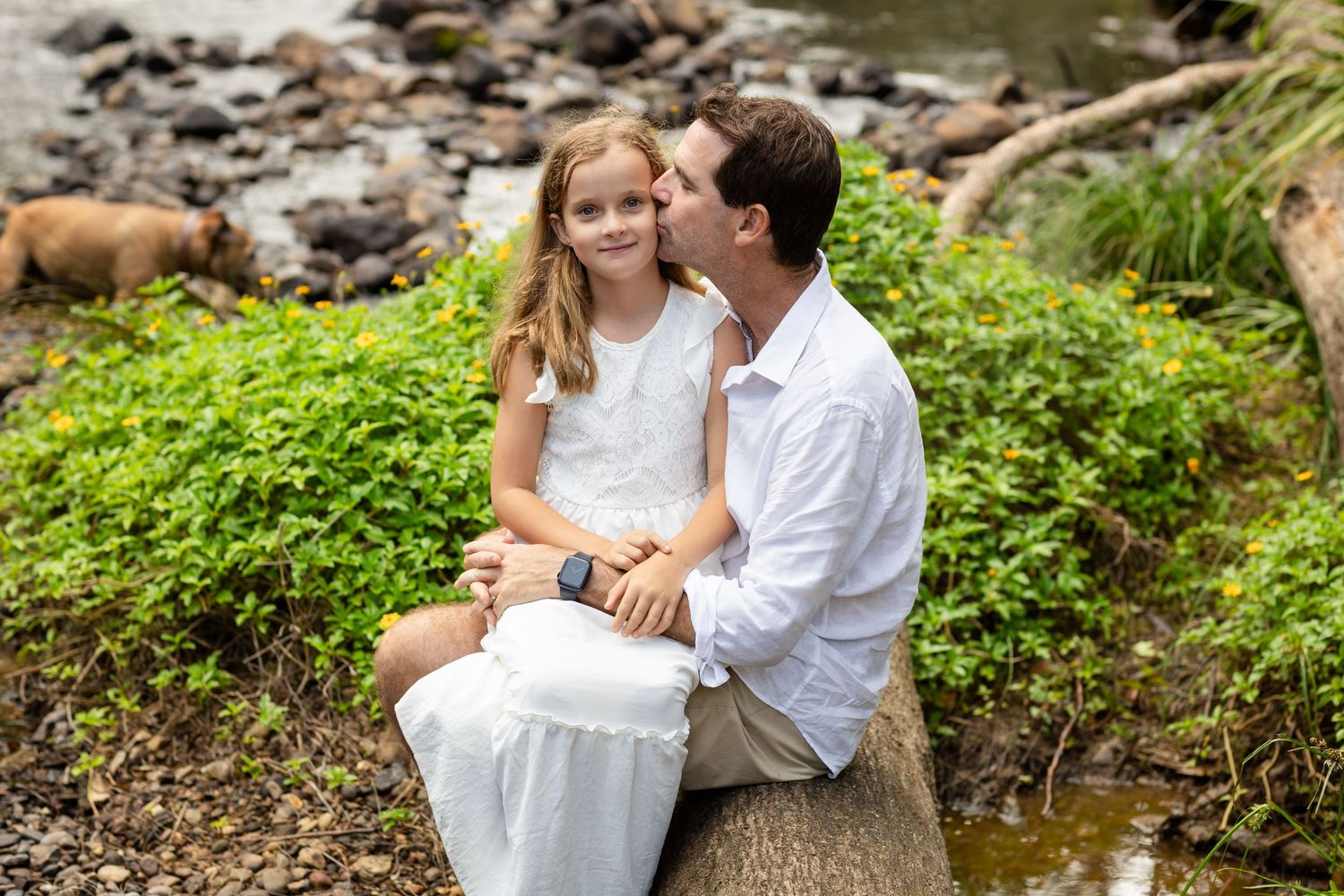 Intimate family portraits taken in a lush green outdoor setting with natural lighting.Tallebudgera family photography. Gold Coast family pho
