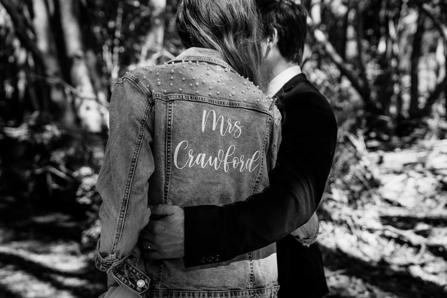Black and white wedding detail shots showing signs and decorative elements.