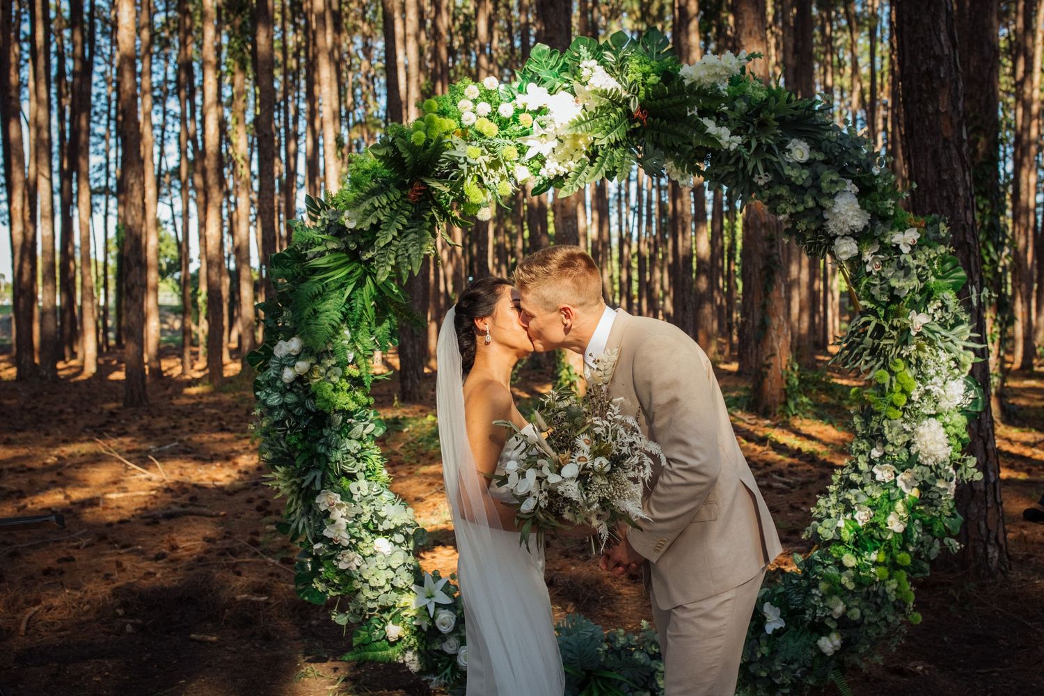 Intimate forest wedding ceremony with natural greenery and pine trees.pizzey park wedding Gold Coast