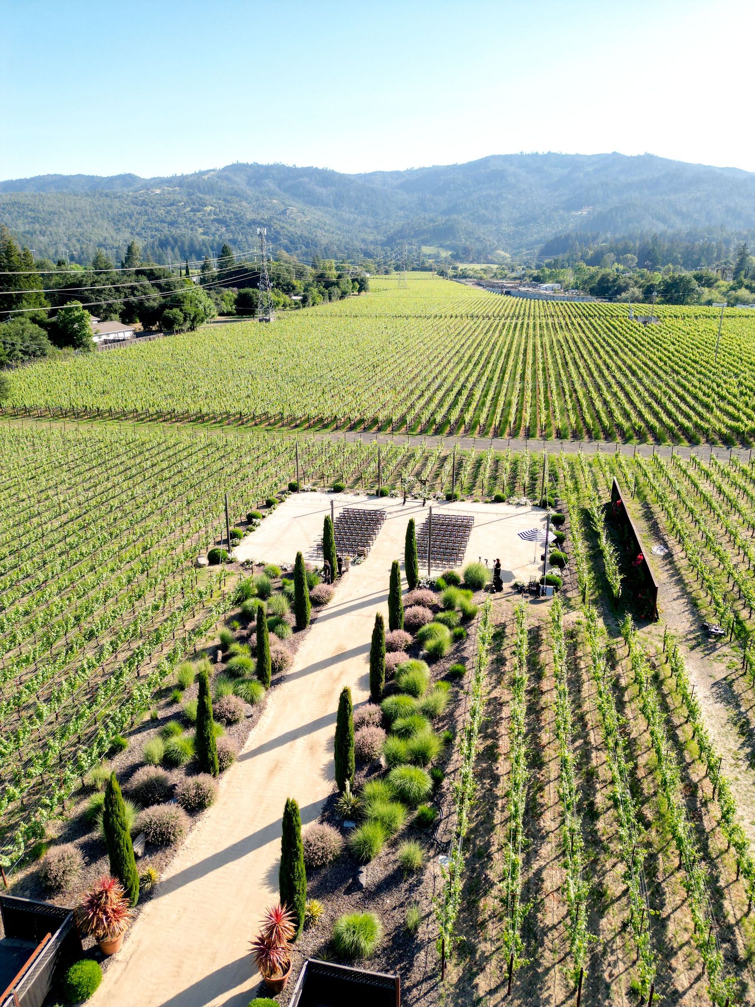 Aerial view of a stunning Napa Valley vineyard wedding venue surrounded by rolling hills.