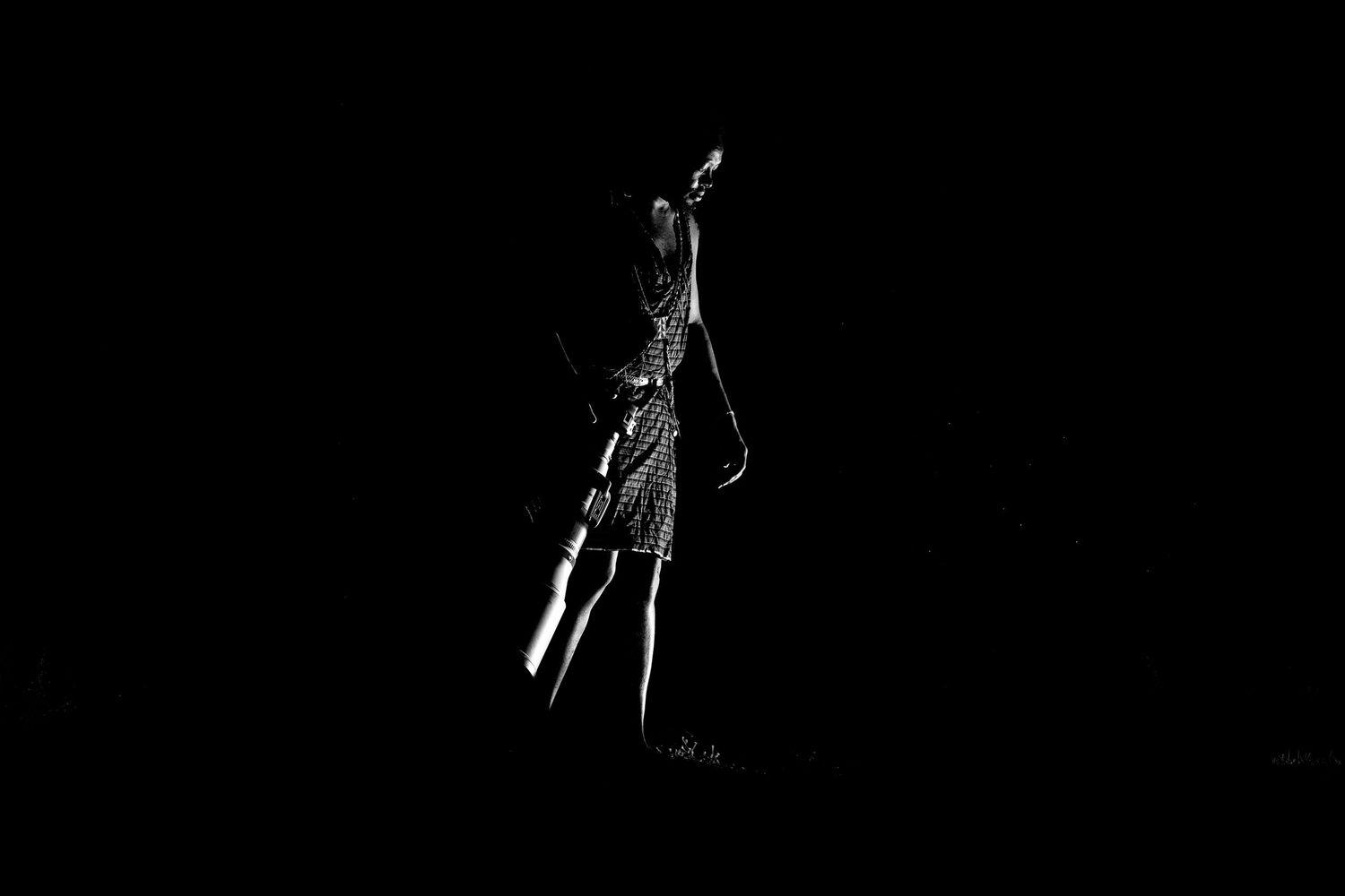 A series of black and white silhouettes showing a person jumping in progressive motion against a dark background.