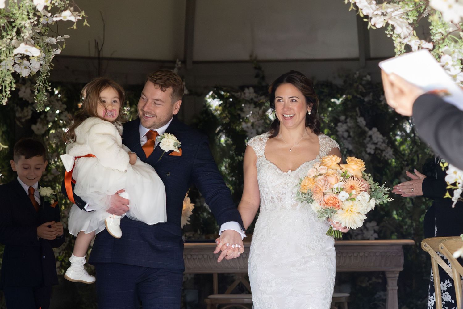 Wedding couple shares romantic moments in a sequence of dance poses at their celebration.