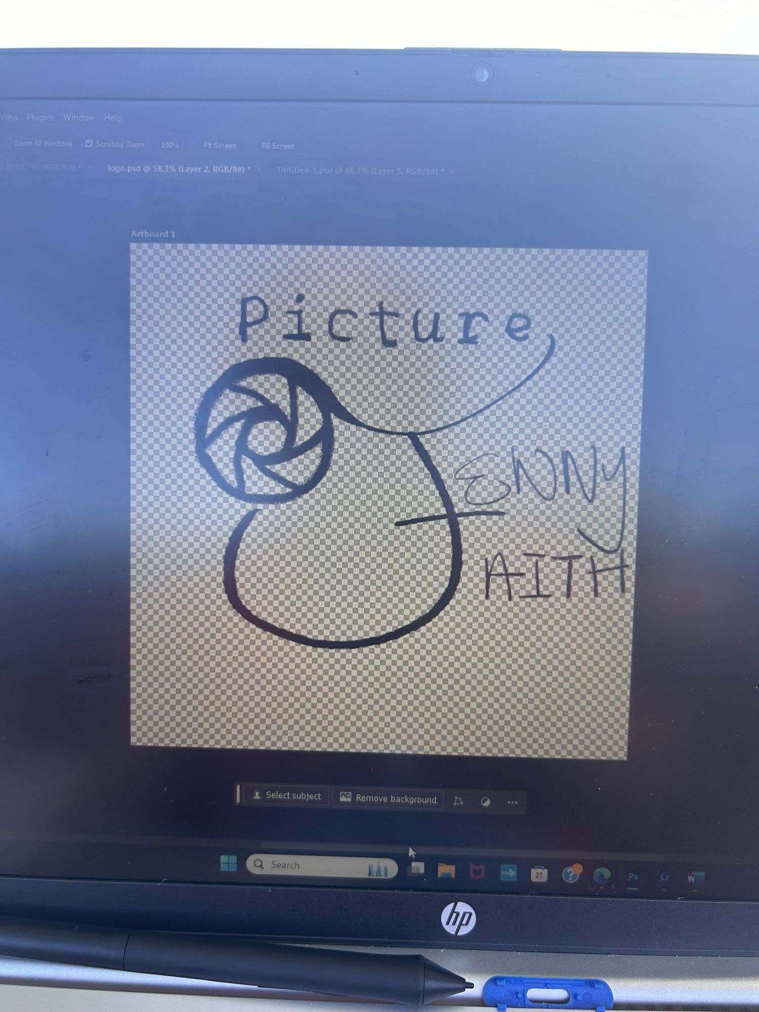 Simple sketch showing a camera lens or aperture icon with handwritten text on a light gray background displayed on an HP monitor.