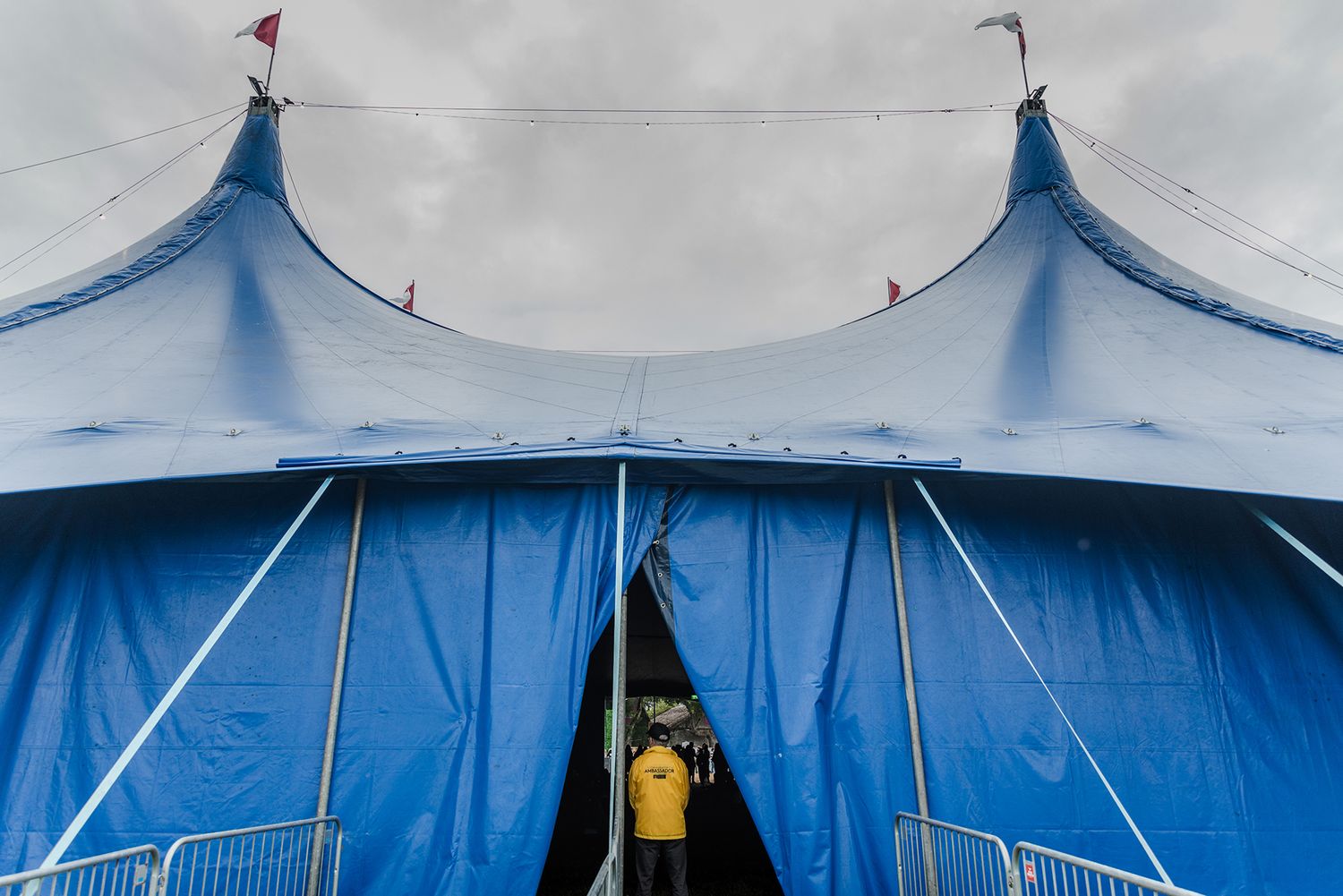 photo of a Galway international arts festival volunteer guarding one of the entrances at the Heineken Big Top during concert