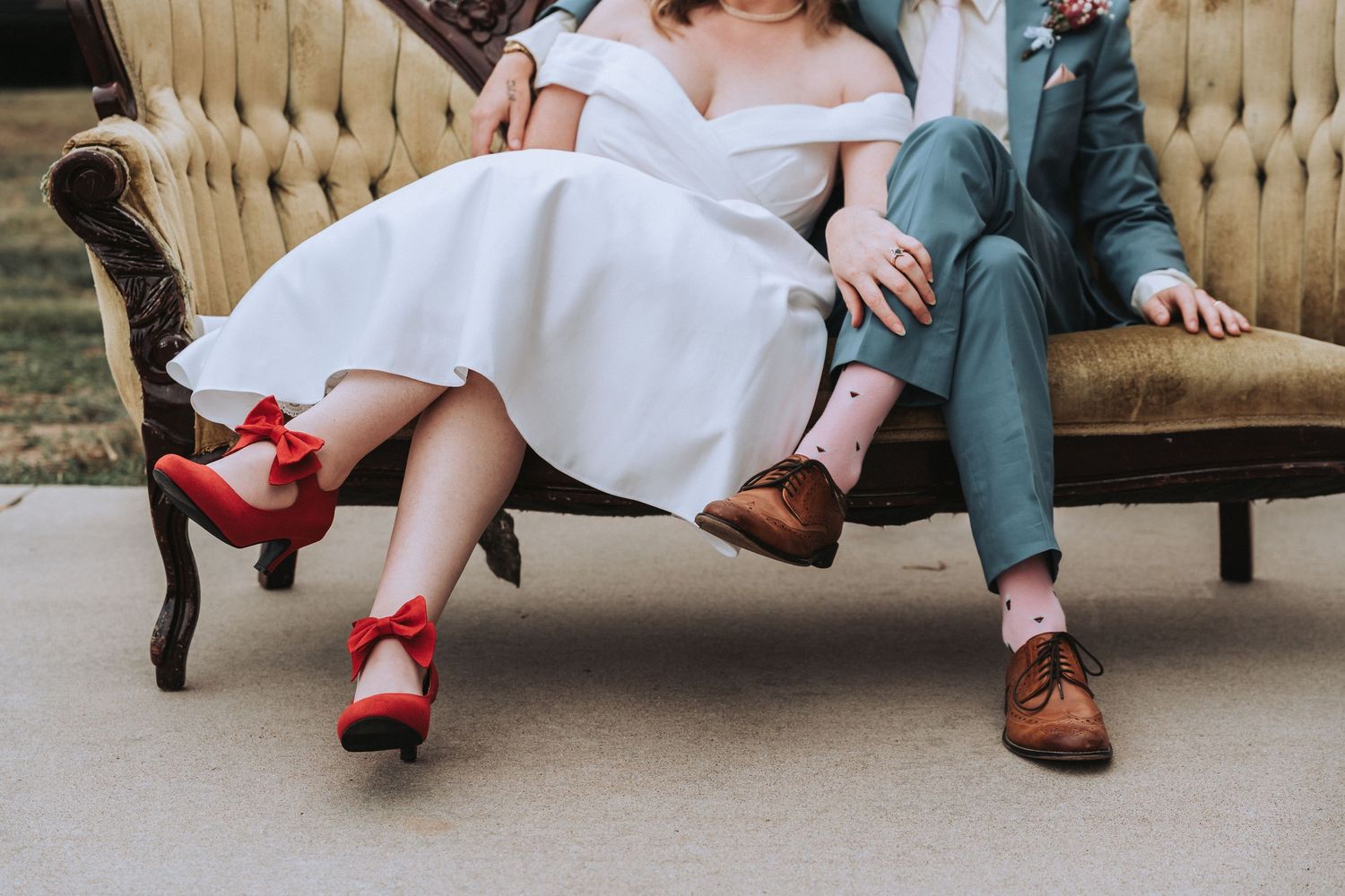 Vintage-style couple sitting on beige couch showing red heels and brown dress shoes in multiple poses.
