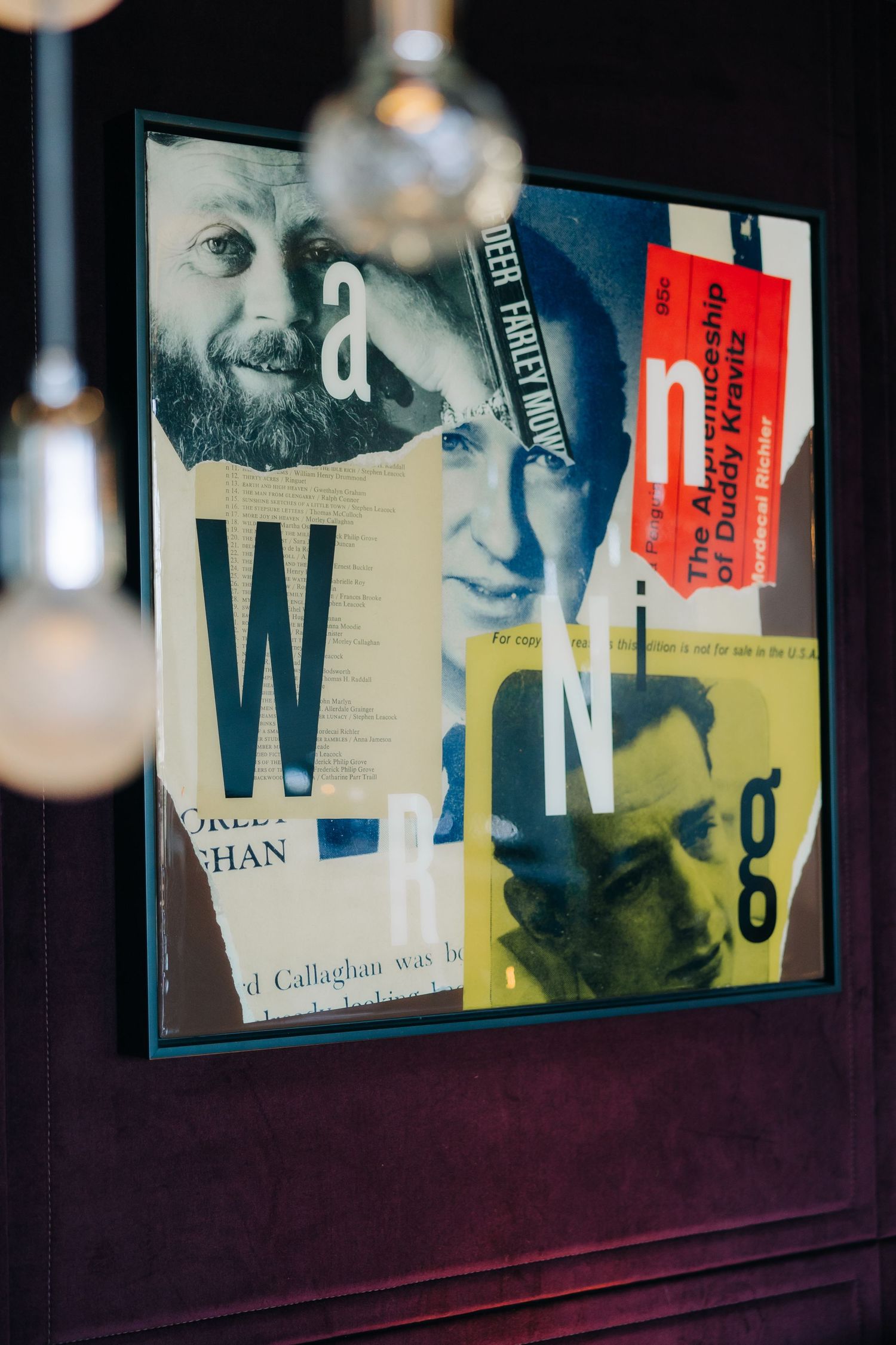 A collage artwork display featuring black and white portraits and text fragments in a dark wooden frame.