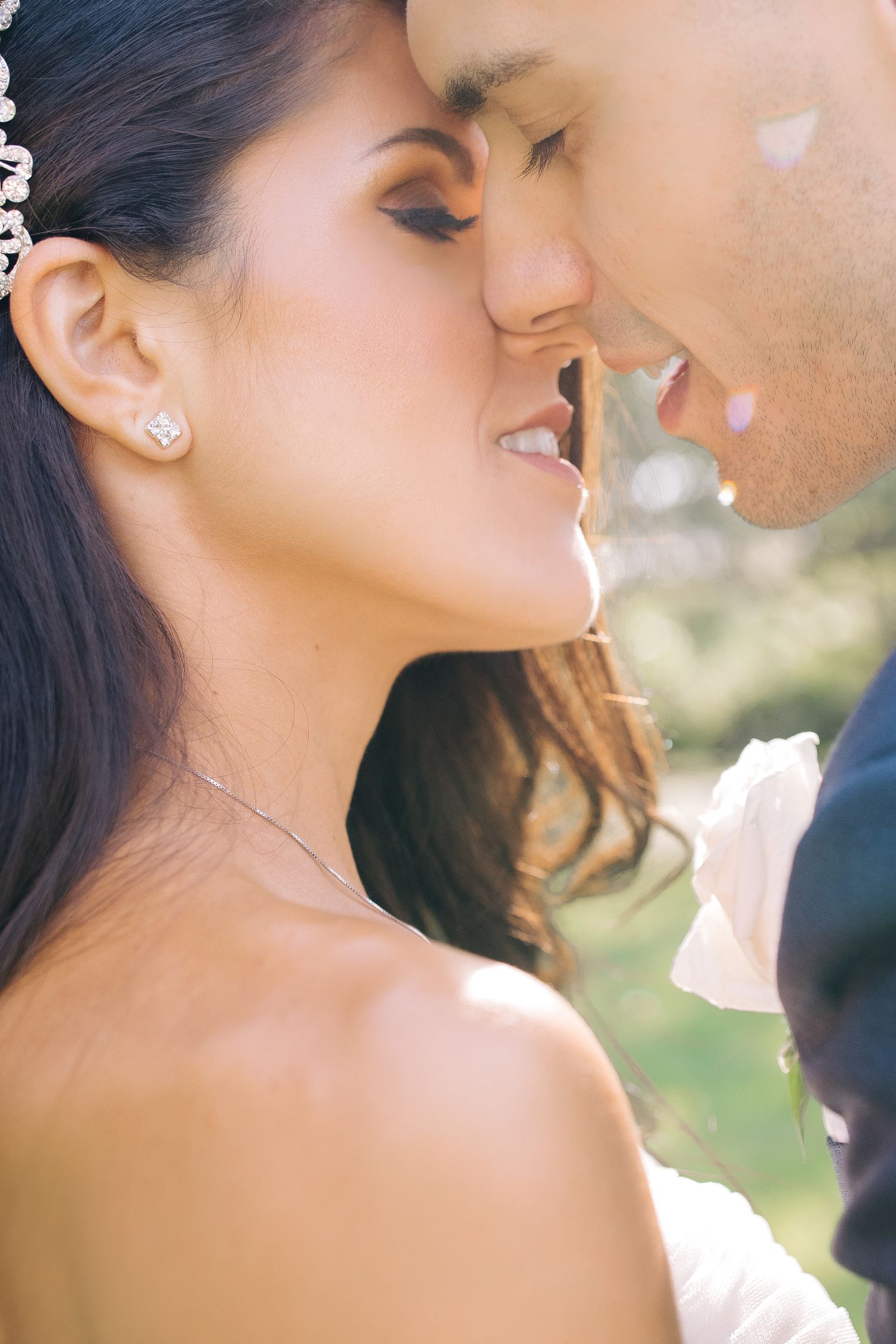 Romantic close-up portrait of newlyweds sharing an intimate moment.