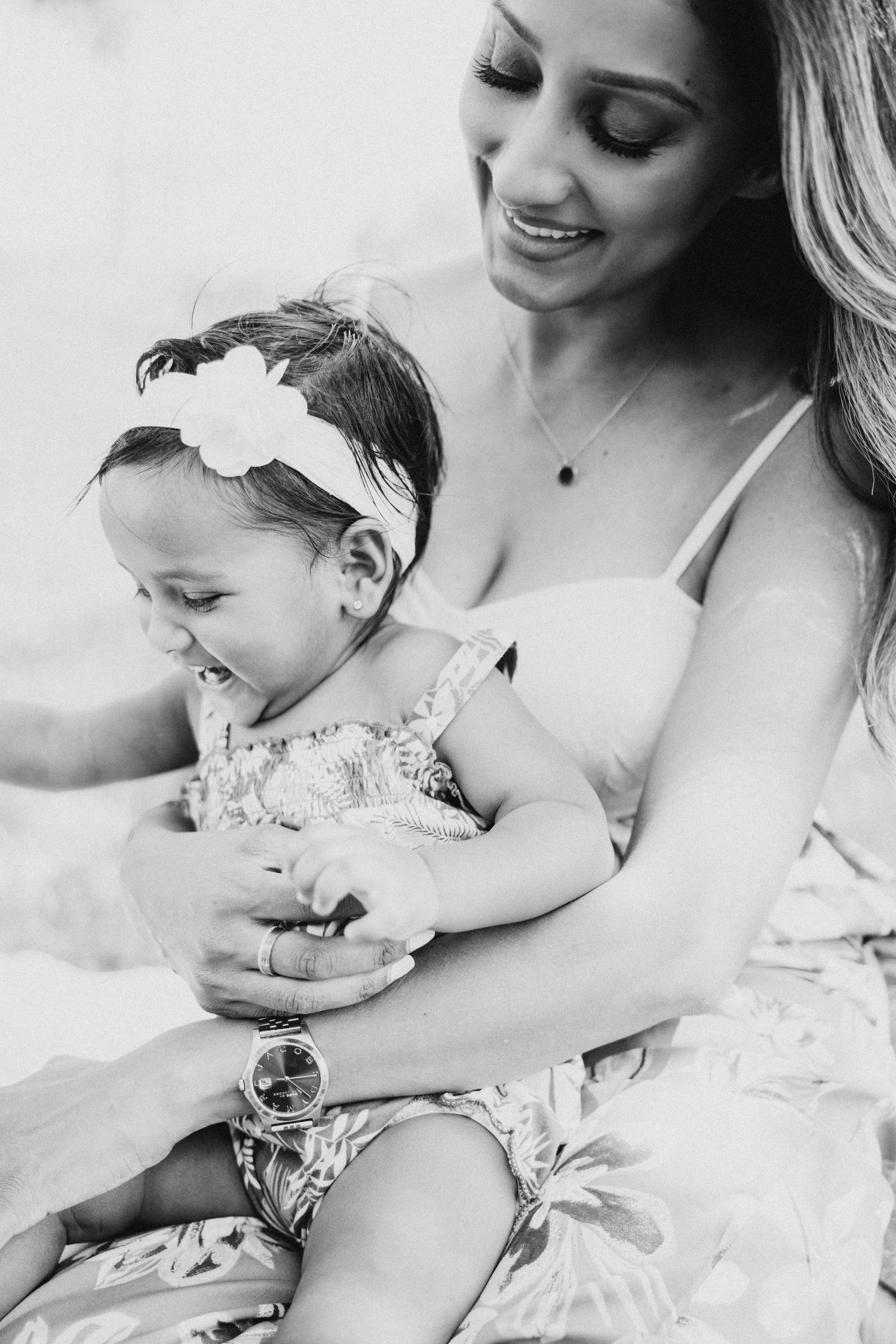 A tender black and white moment between mother and child during a casual photo session.