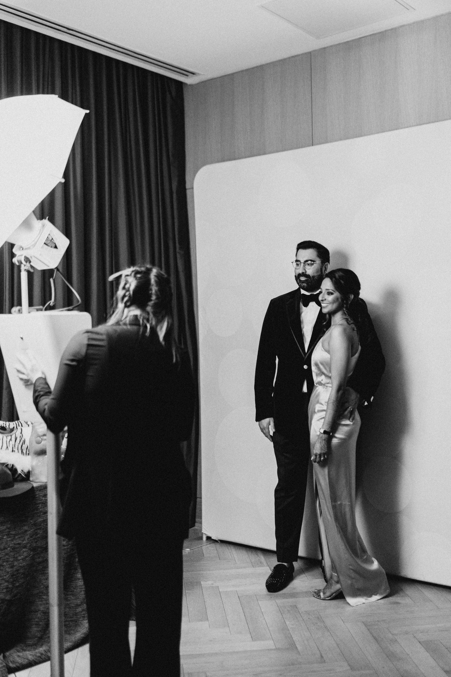 Behind-the-scenes photo of formal portrait session with studio lighting.