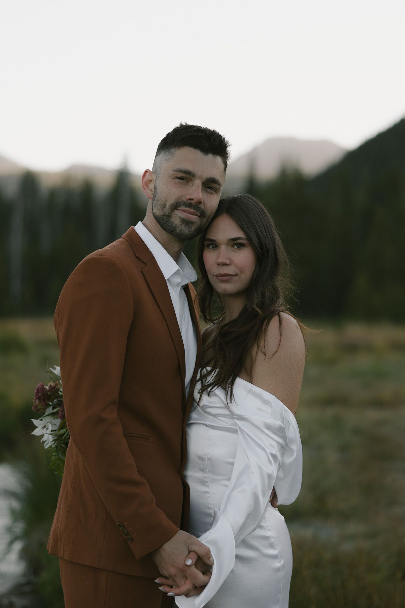 Oregon model couple, Avery and Javan Darling, look at the camera as they pose for a sunrise elopement.