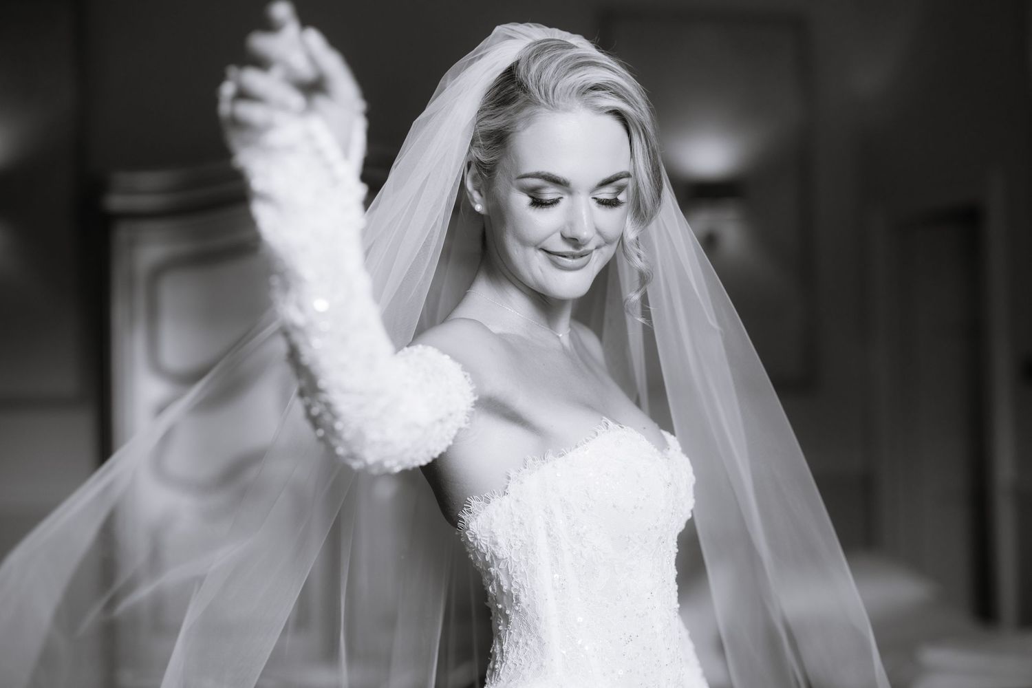 Six romantic black and white photos showing intimate bridal moments with elegant wedding dresses and veils.