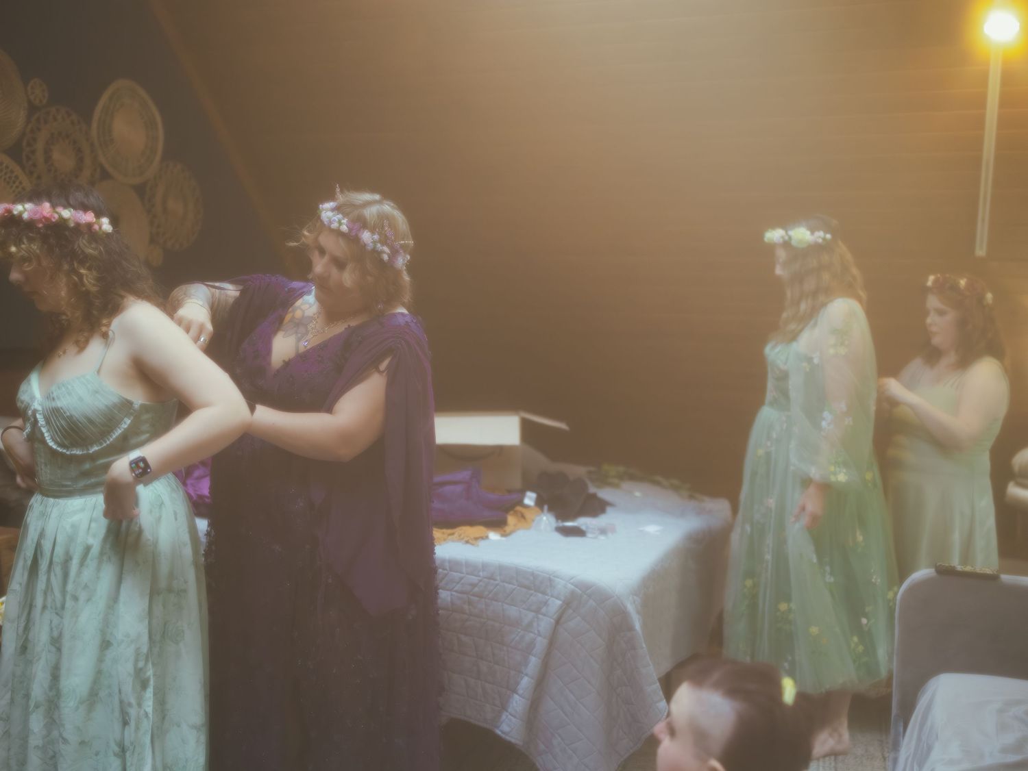 Couples dance together in an intimate setting during what appears to be a romantic slow dance at an evening event.