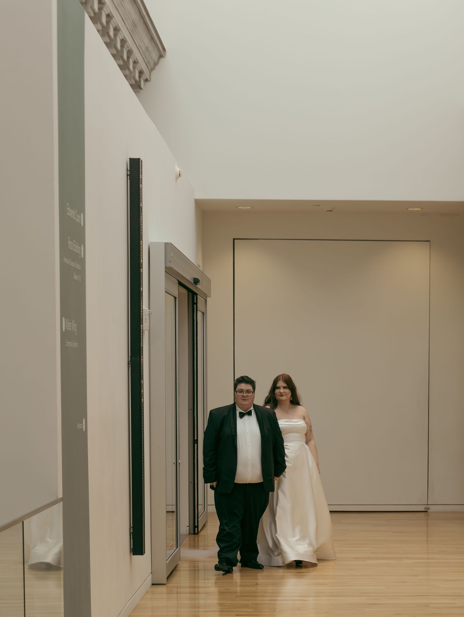 Interior hallway scene with modern white walls and minimalist design.