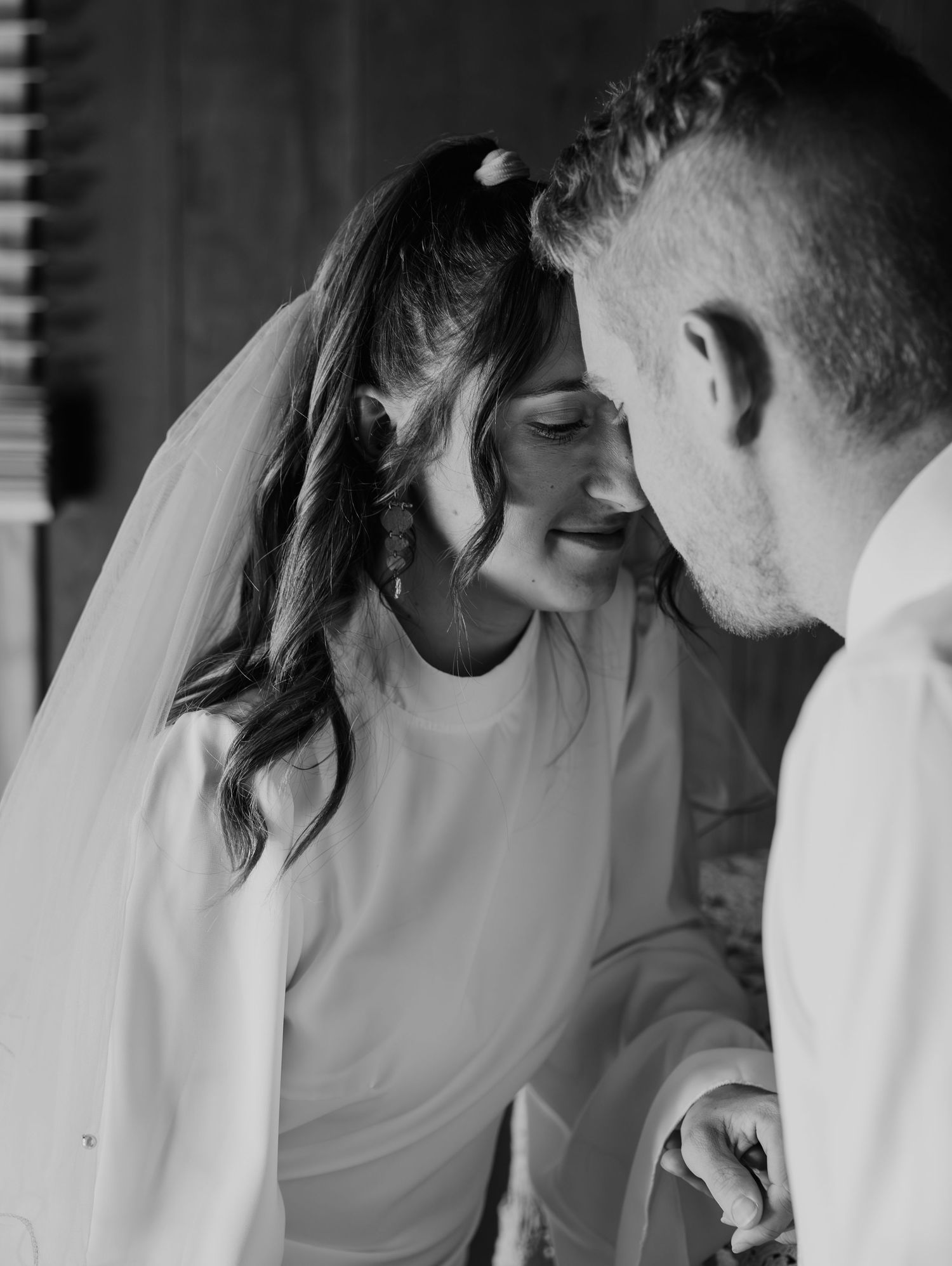 A romantic black and white wedding montage showing tender intimate moments between newlyweds.