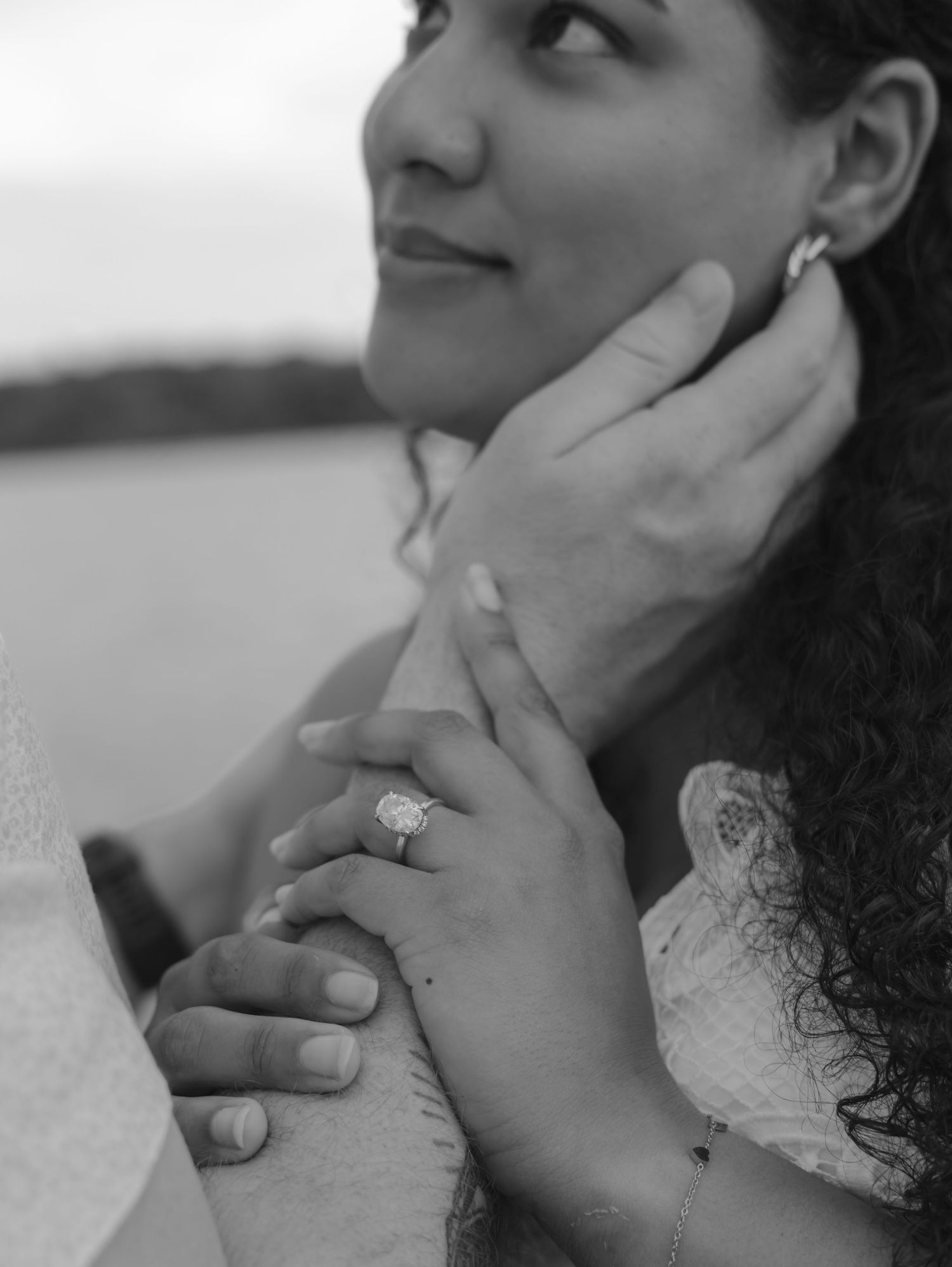 Close up black and white photos capturing loving facial expressions and gentle touches between partners.