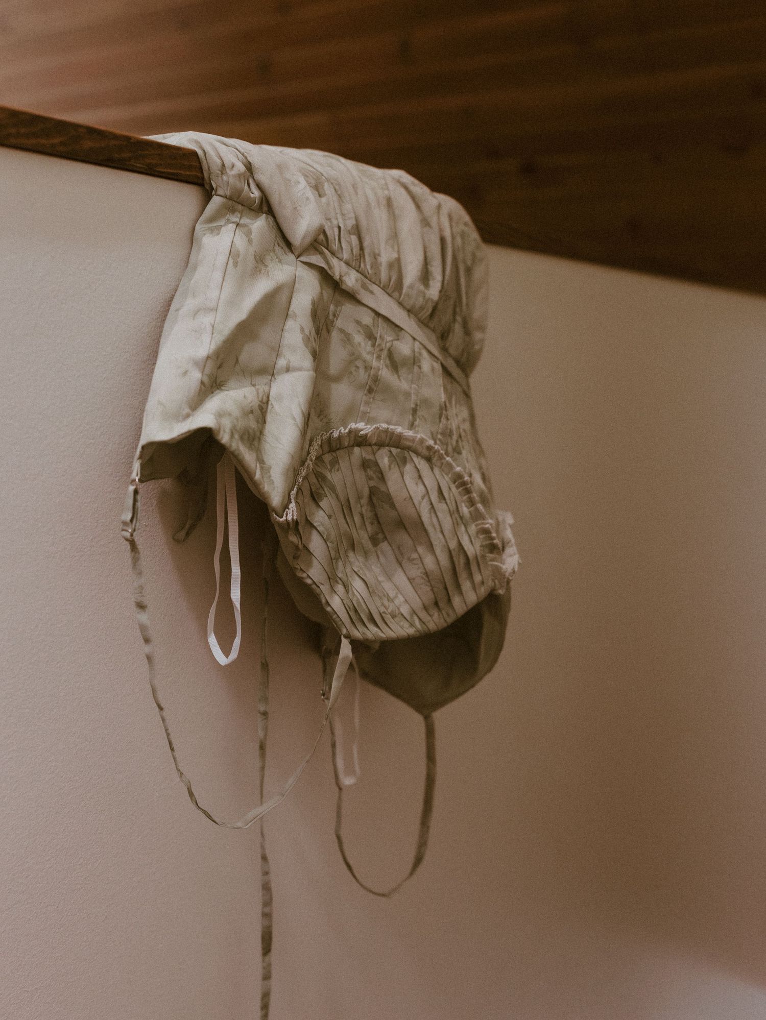 A series of vintage-style photographs hanging to dry, showing a sepia-toned artistic display.