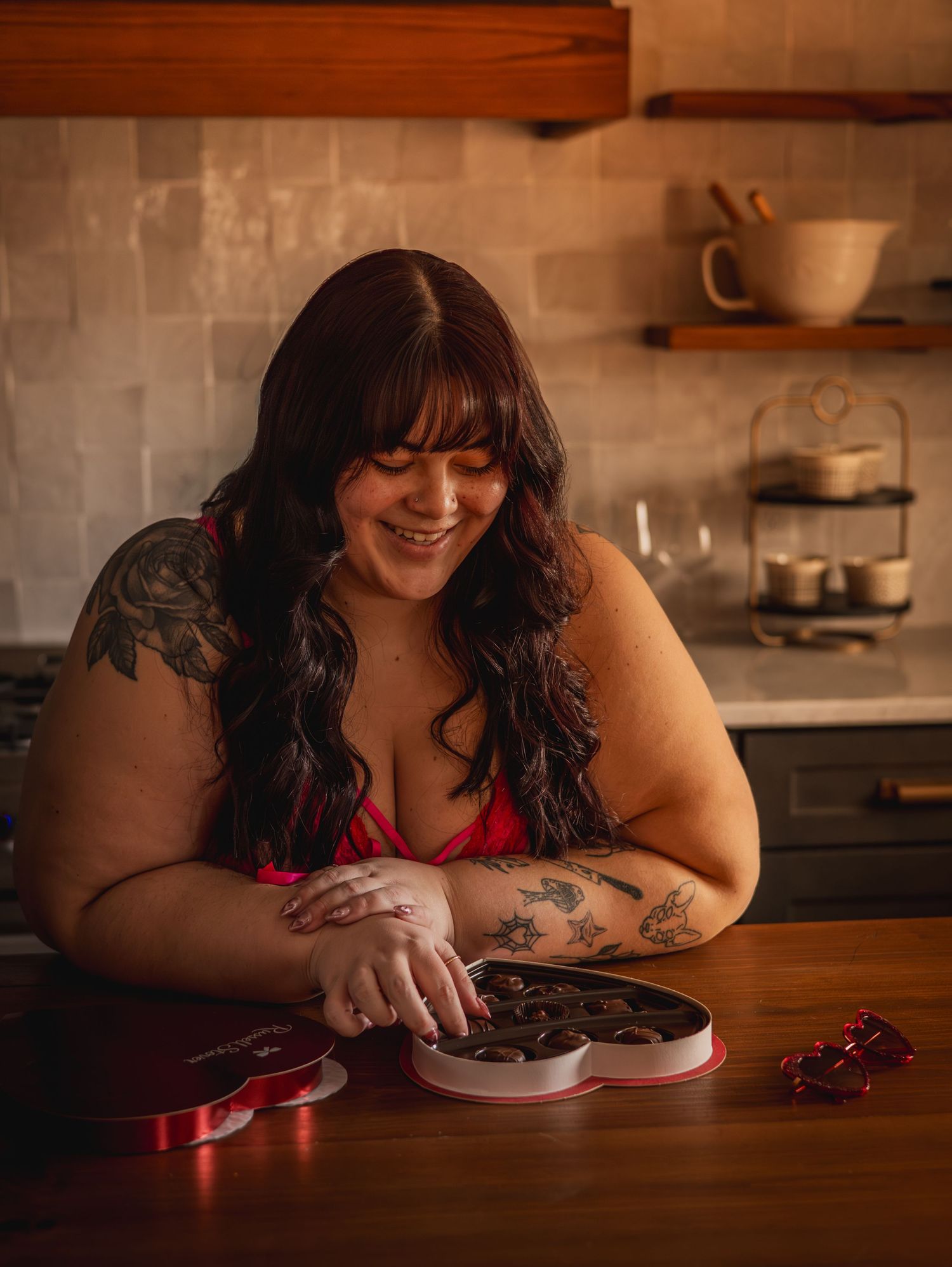 A cozy kitchen scene with chocolates and Valentine's Day decorations.