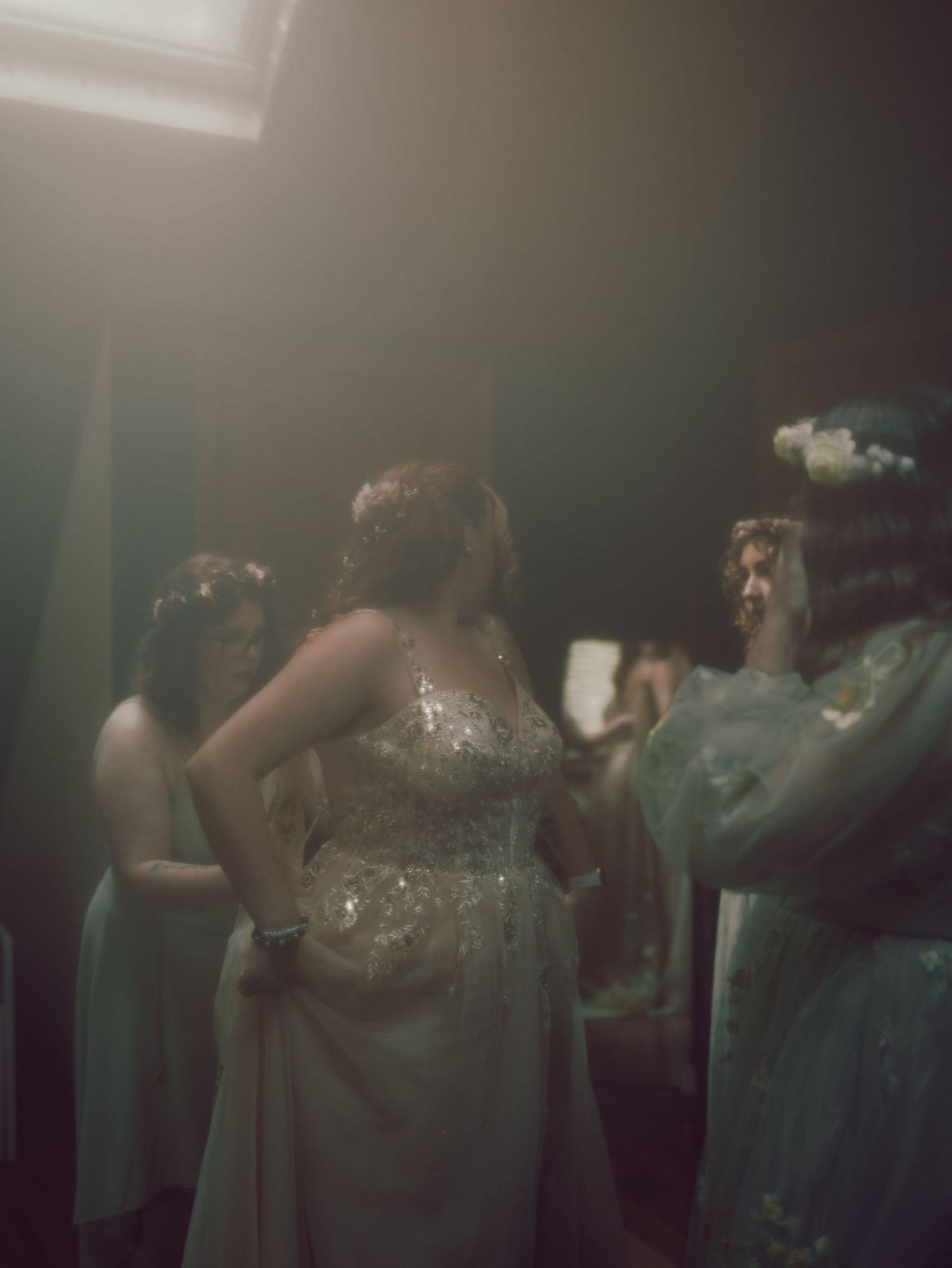 Elegant bridesmaid dresses in soft mint green hang on display at a wedding venue.
