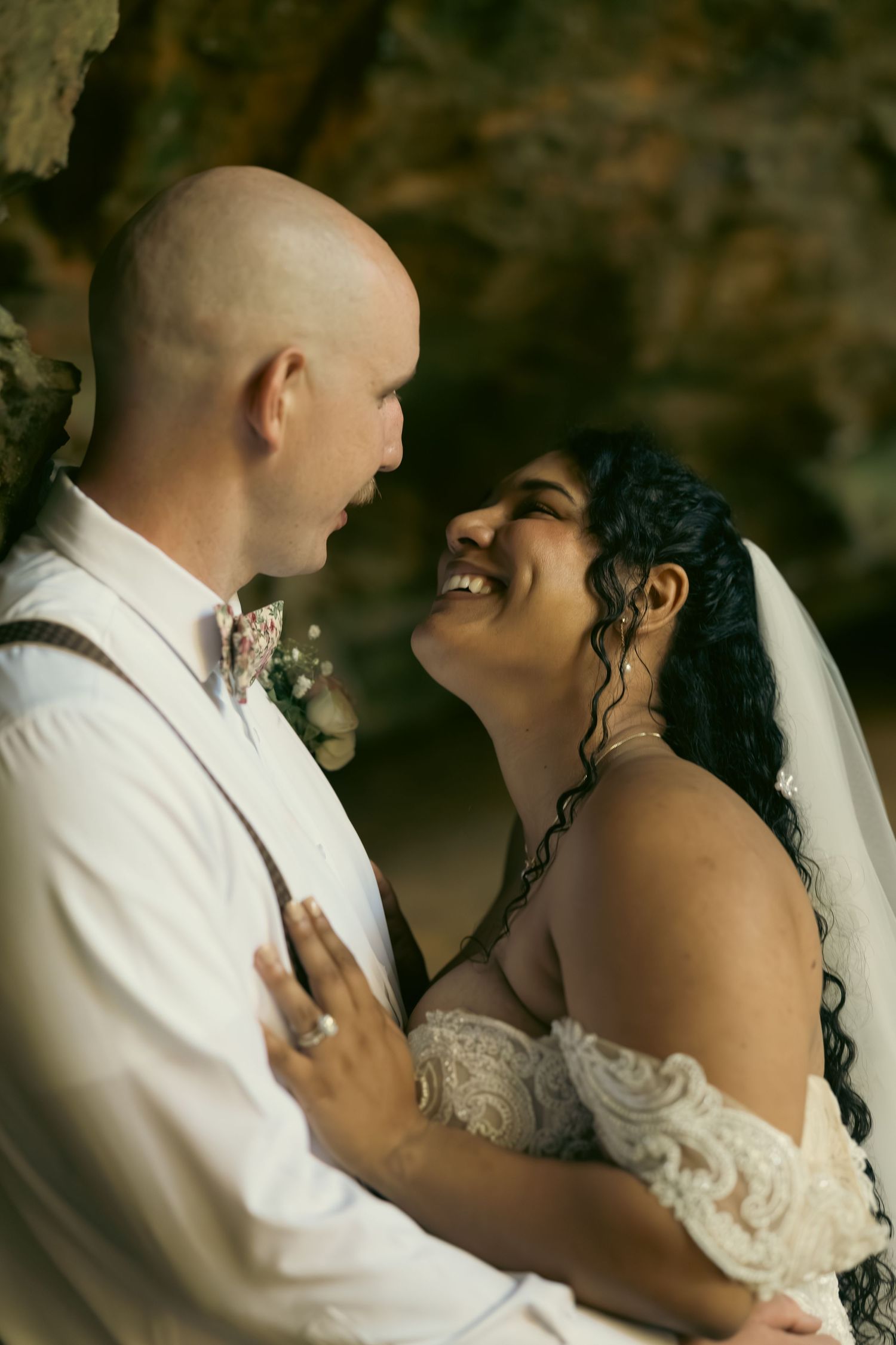 Intimate wedding portrait capturing tender moments between newlyweds.