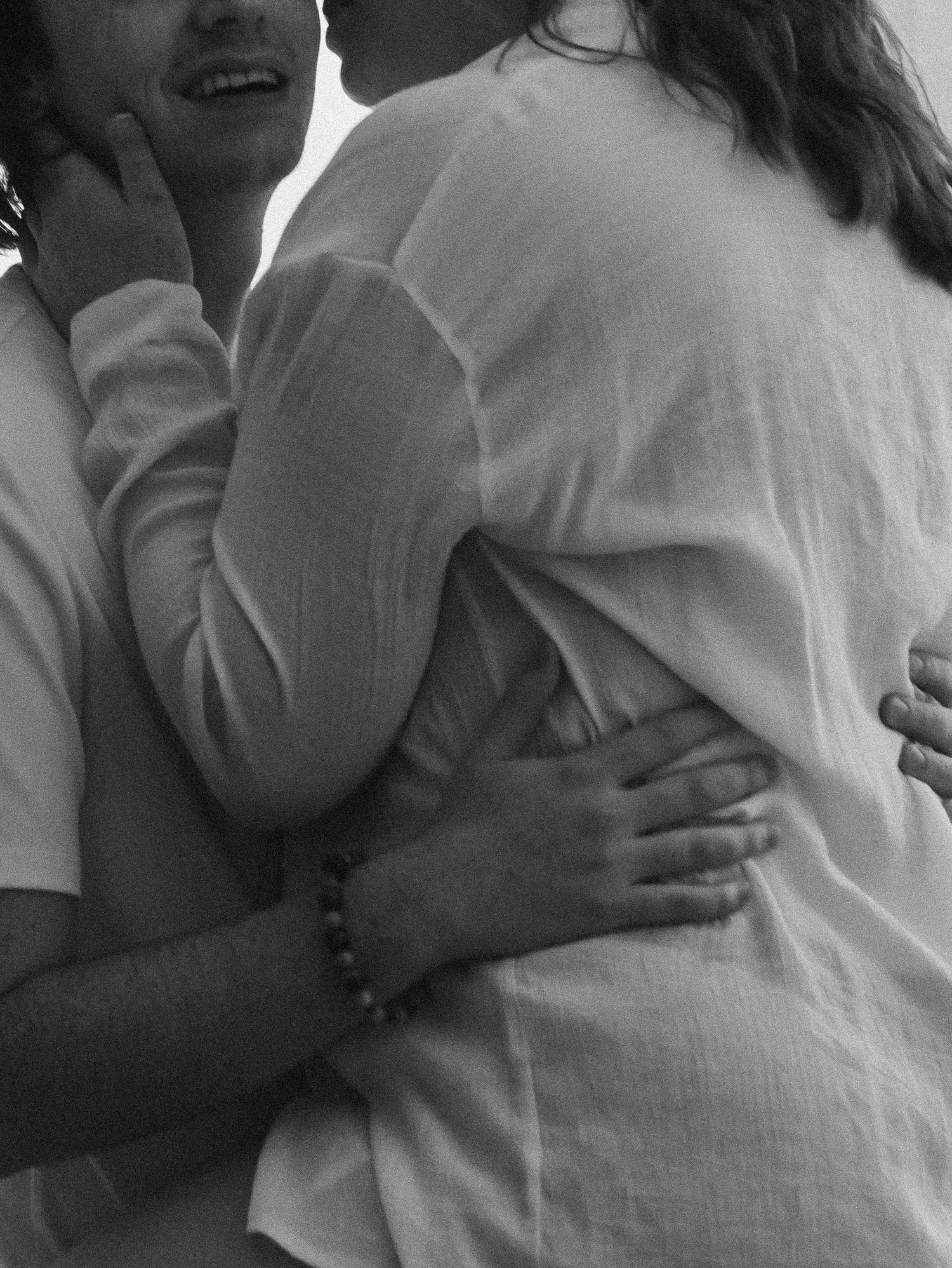 Romantic black and white sequence capturing tender moments between couple in soft lighting.
