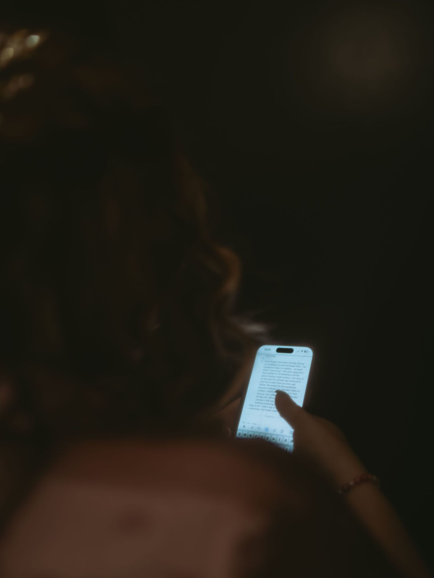 A dark atmospheric photo with a glowing blue light source in the corner.
