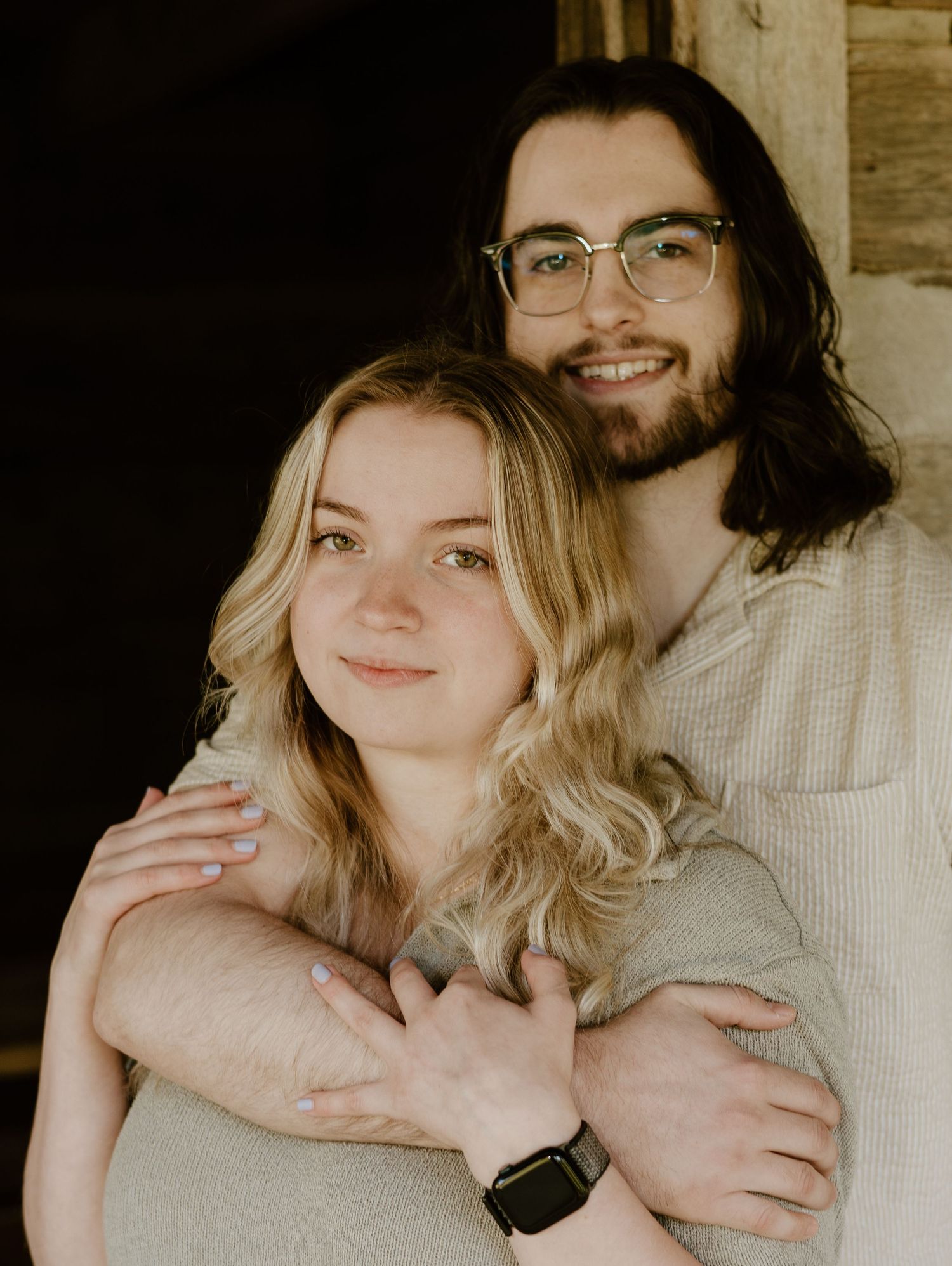 A collection of intimate sepia-toned photographs showing tender moments between a couple in warm lighting.