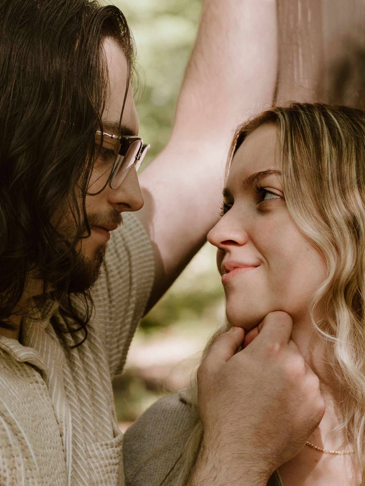 A romantic couple shares an intimate moment in a series of close-up shots showing them drawing closer together.