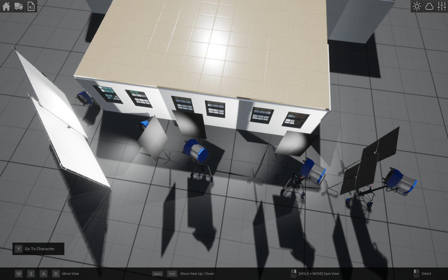 Electronics displays and tablets mounted on wall mounts in a bright white retail environment.