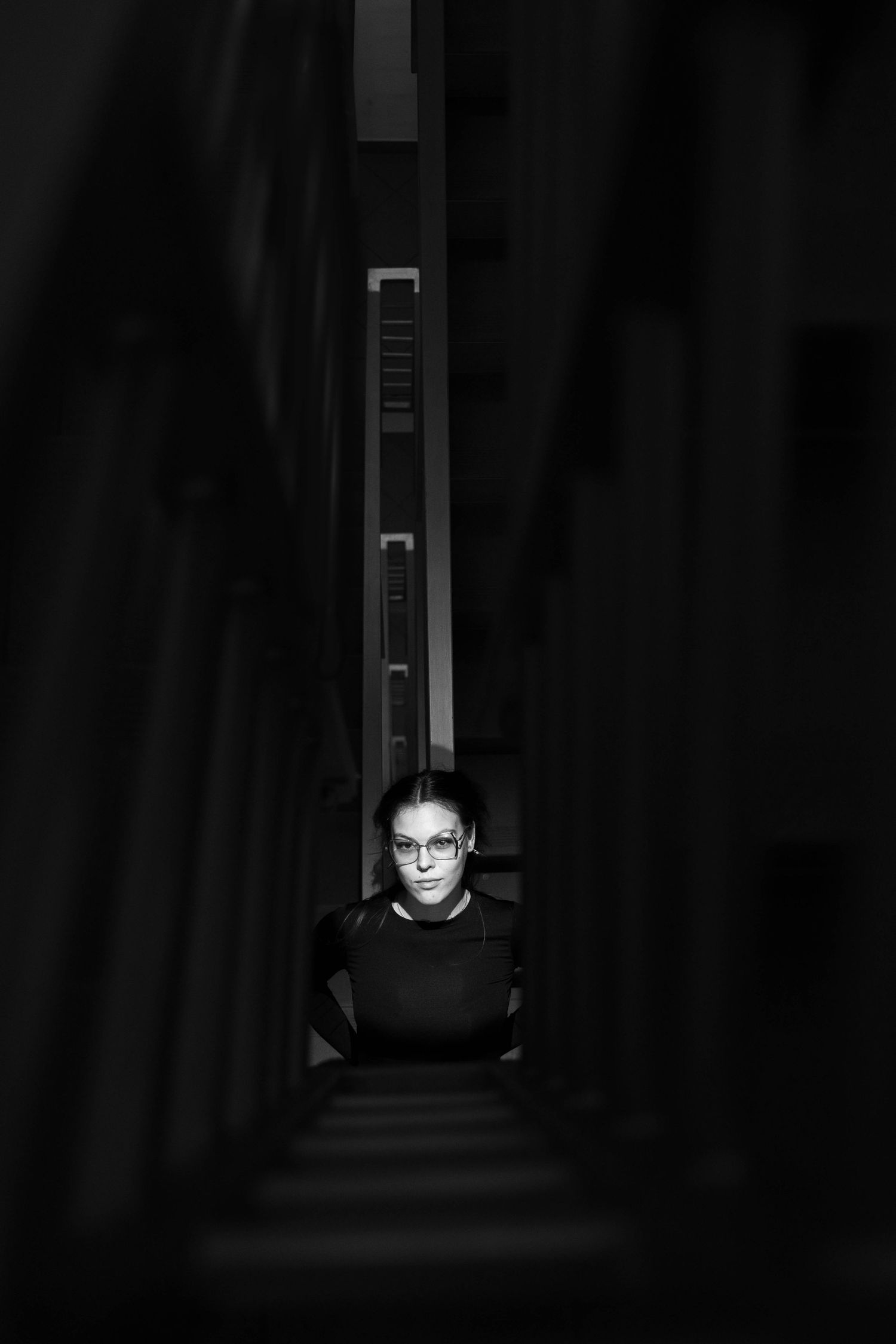 Dramatic black and white corridor shot with strong perspective lines.