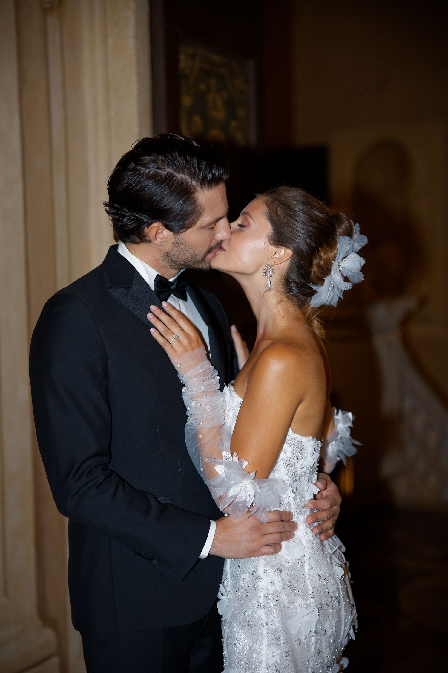 Intimate dance moment at elegant indoor wedding reception.