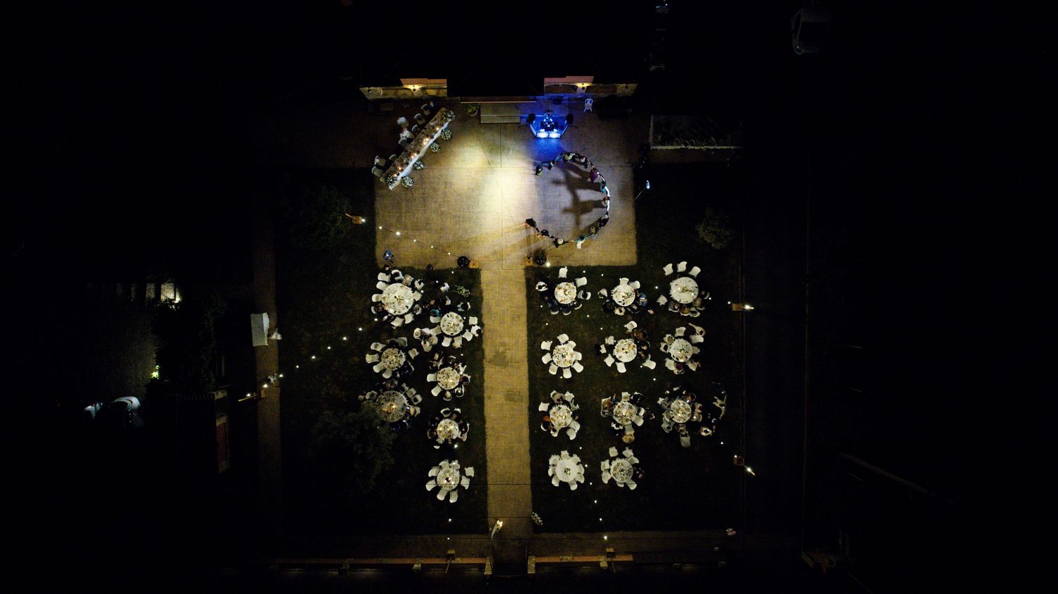 Dark atmospheric night scene with twinkling lights creating a romantic ambiance.