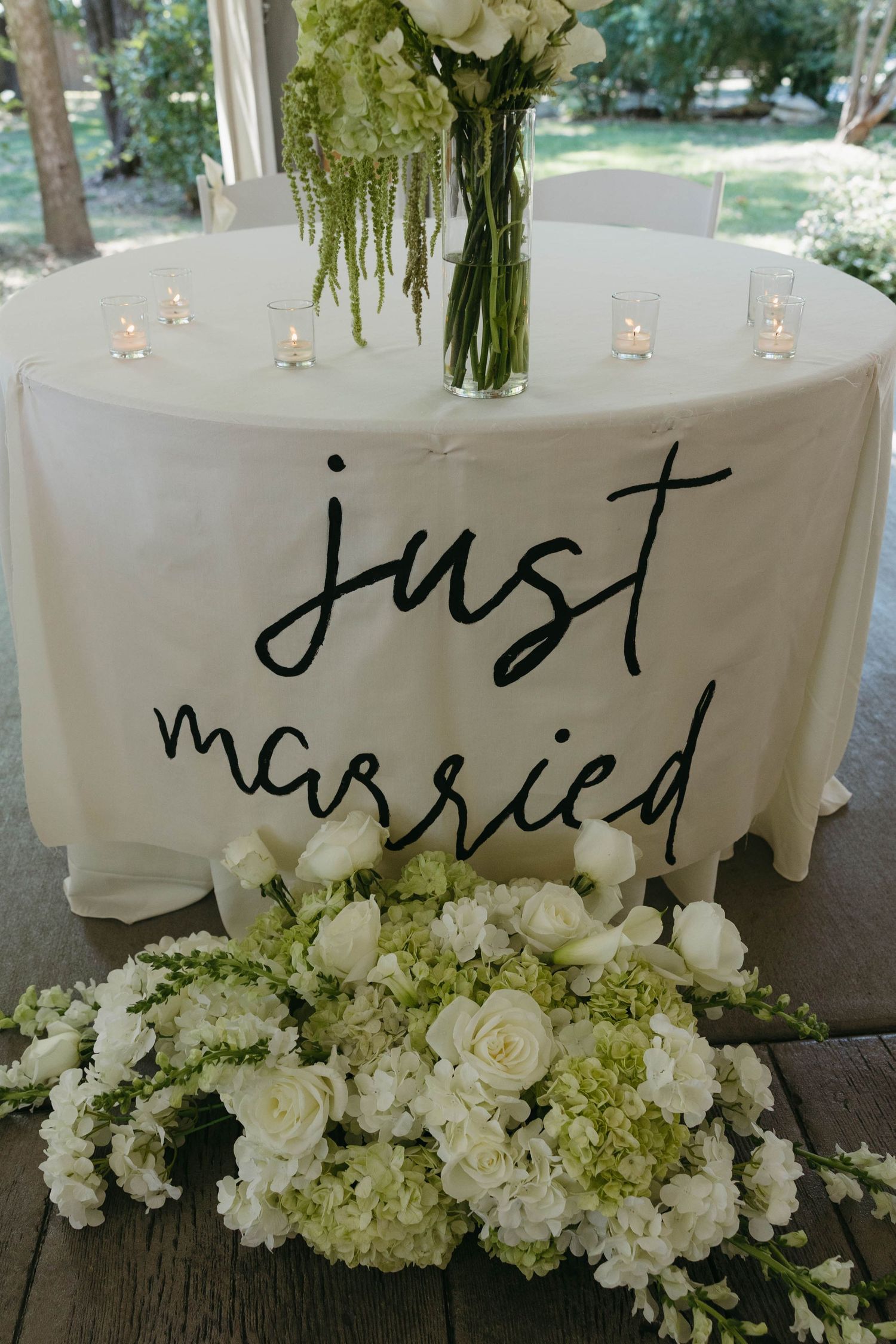 Birmingham Alabama Photographer capturing bride's wedding details and sweetheart table at Iris Woods Venue in Nashville, Tennessee