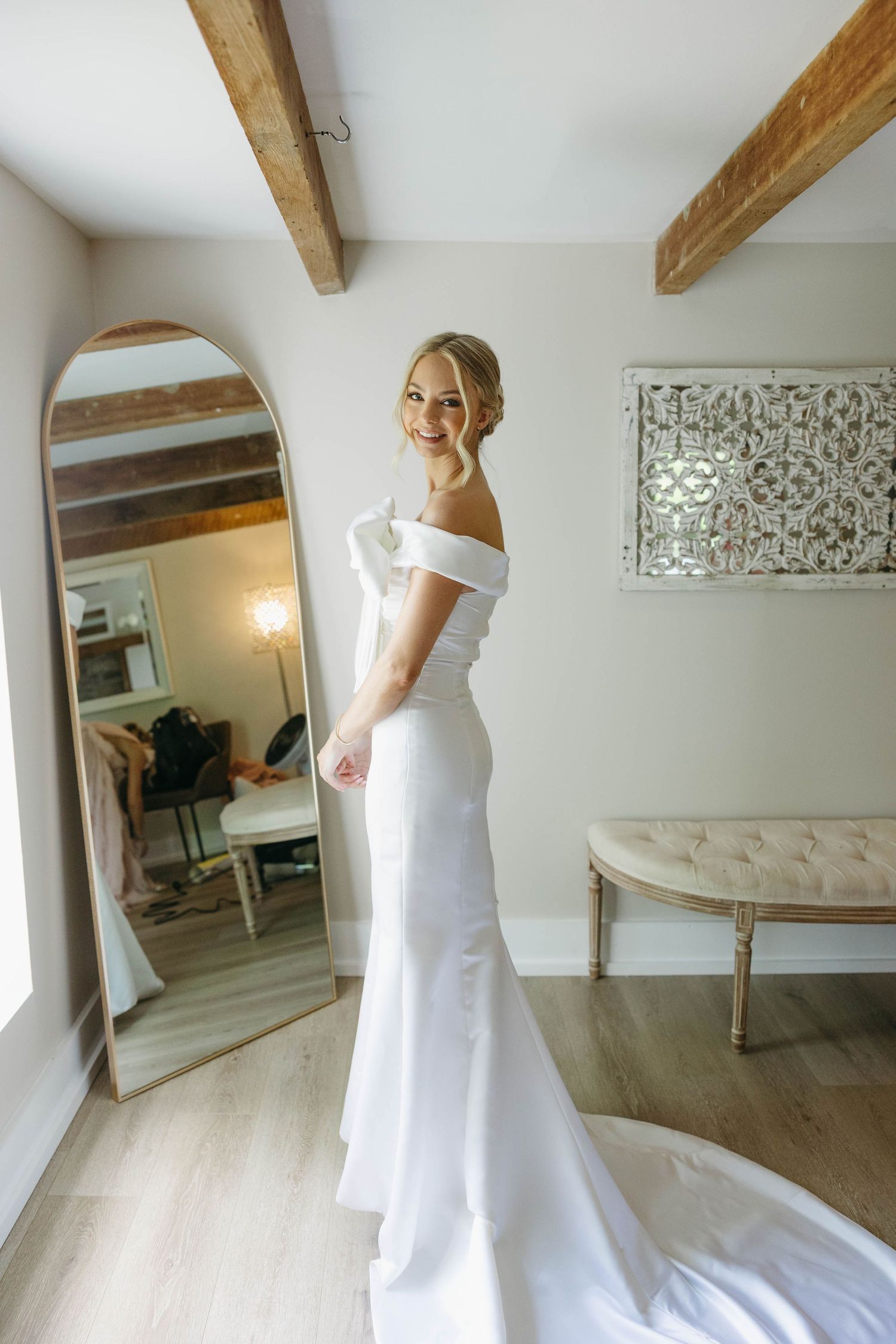 bride posing in front of mirror