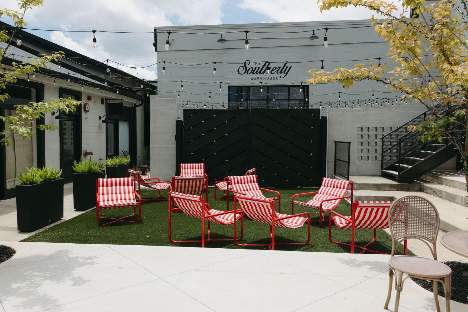 Birmingham Alabama Photographer capturing a group of striped red chairs at the Southerly Wedding Venue in Opelika Alabama