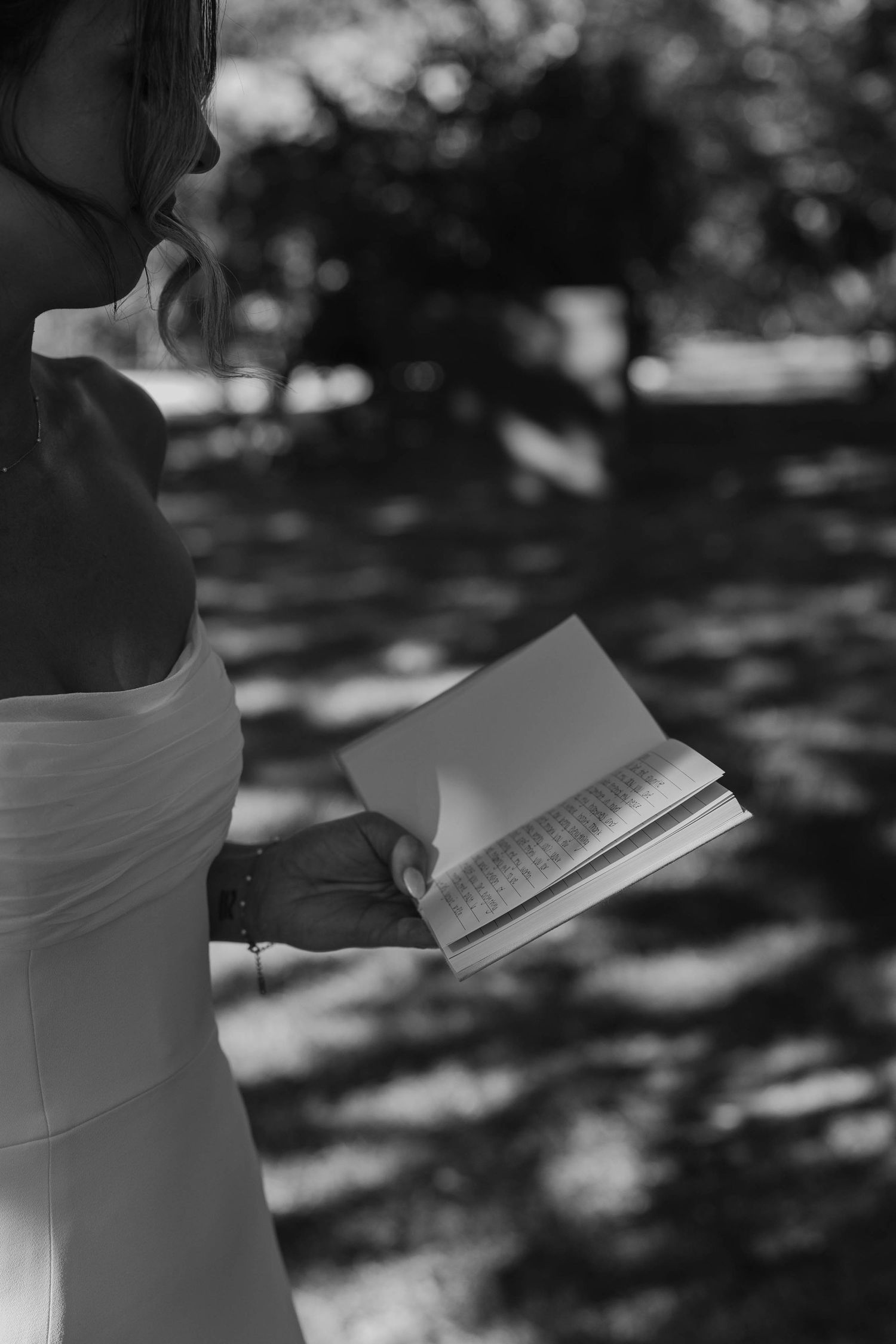Birmingham Alabama Photographer capturing bride and groom reading their pre wedding vows, at Iris Woods Venue in Nashville, Tennessee