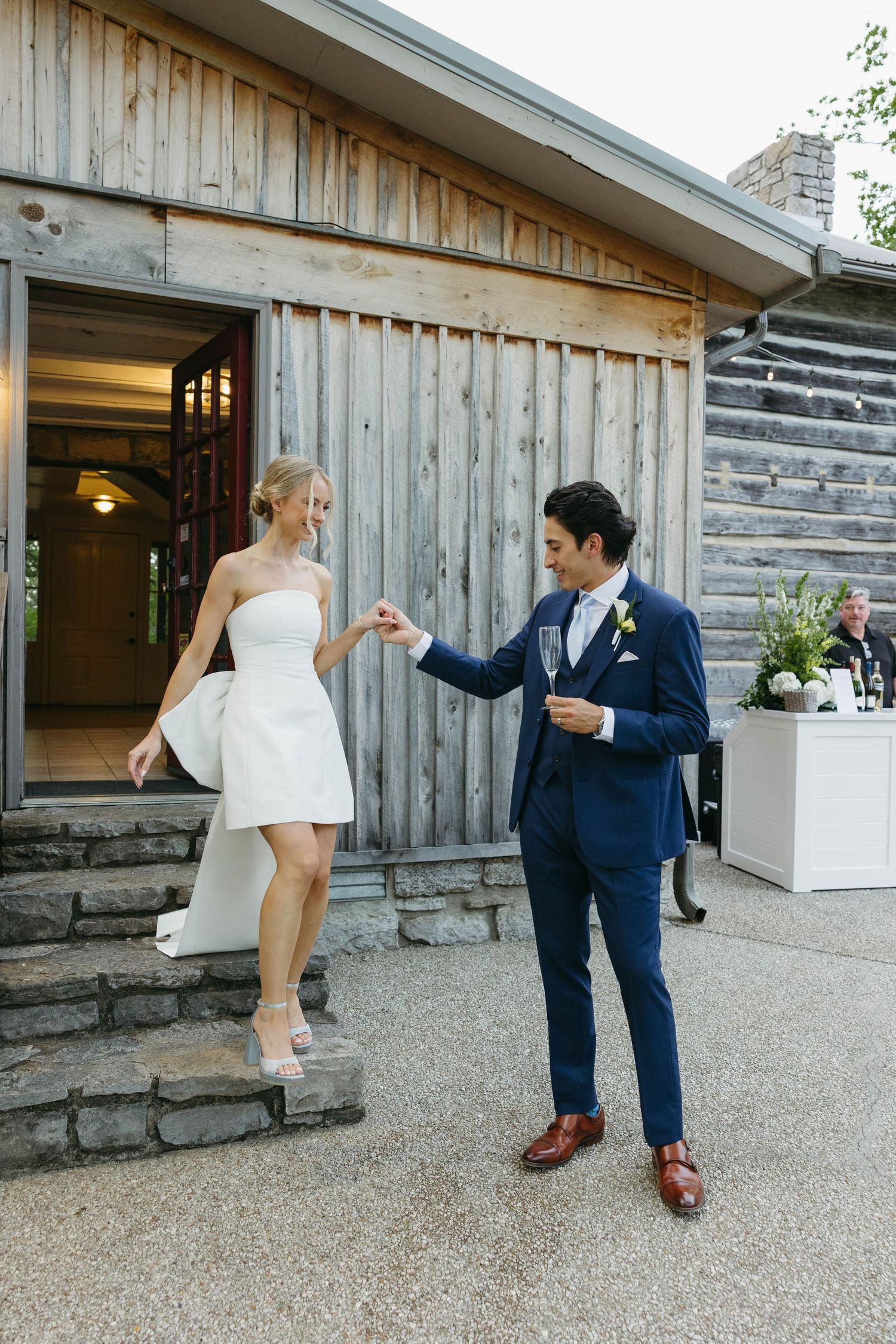 Birmingham Alabama Photographer capturing Bride and groom walking to their reception at iris woods wedding venue in Nashville Tennessee