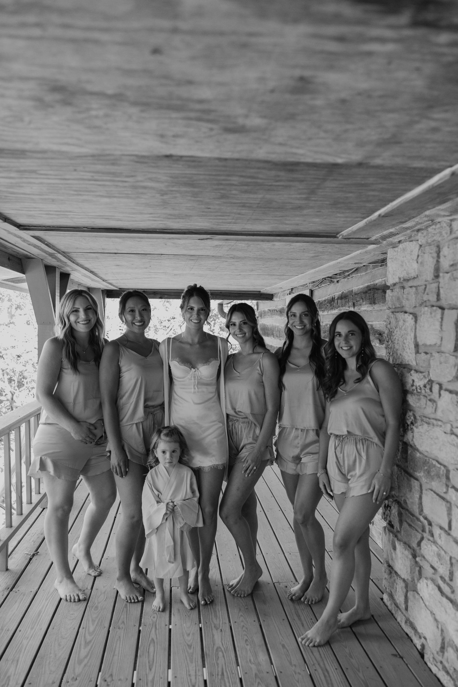Birmingham Alabama Photographer capturing bride and bridesmaids posing at Iris Woods Venue in Nashville, Tennessee
