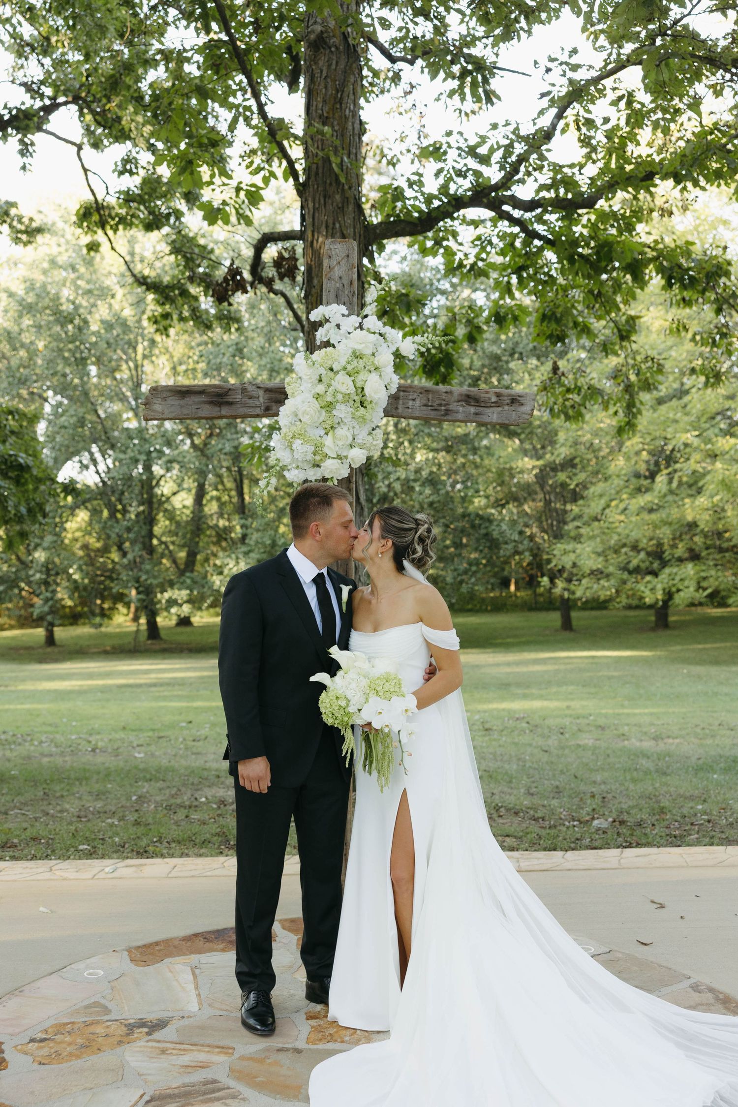 Birmingham Alabama Photographer capturing bride and groom posing at ceremony space, at Iris Woods Venue in Nashville, Tennessee