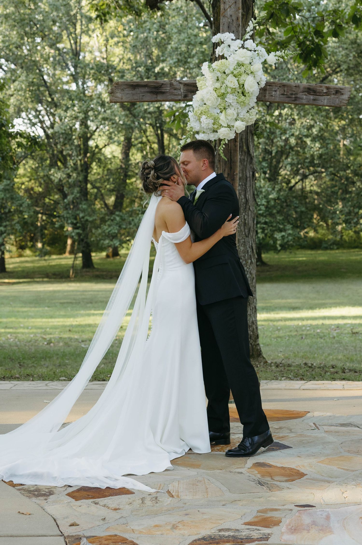 Birmingham Alabama Photographer capturing bride and groom kissing at ceremony space, at Iris Woods Venue in Nashville, Tennessee